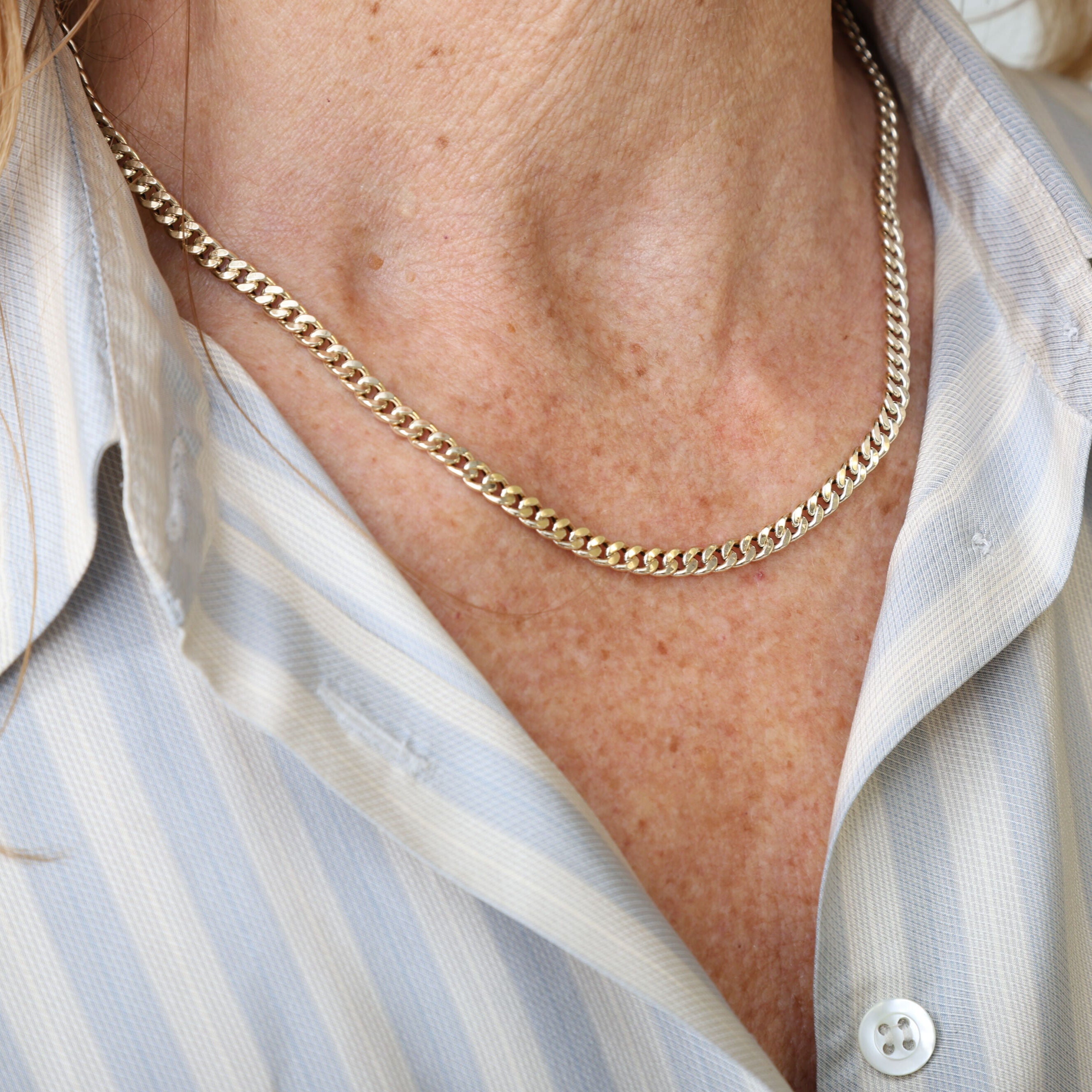 14K Gold Faceted Miami Cuban Link Necklace complementing a casual chic outfit, perfect for effortless style and everyday comfort.