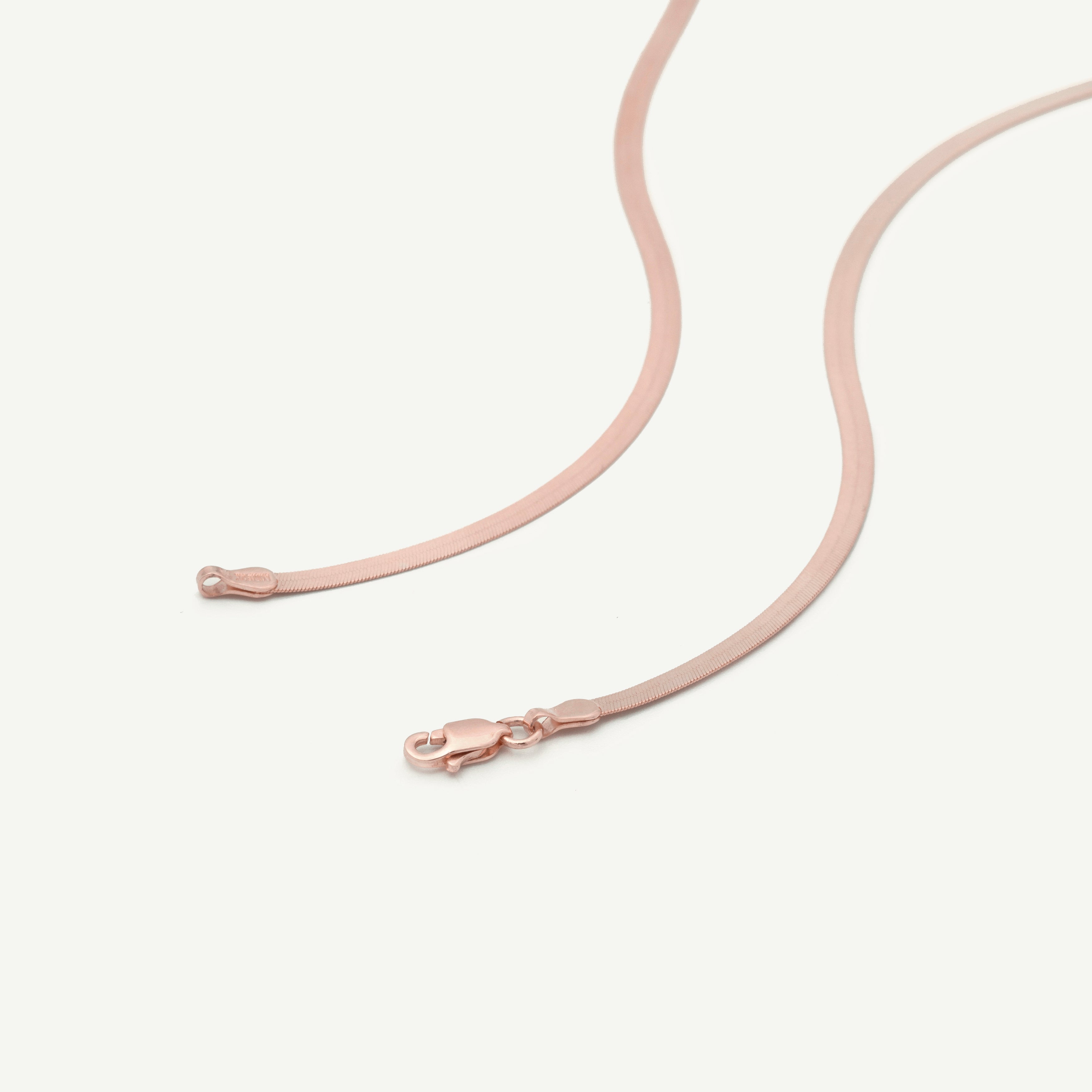 14K Solid Rose Gold Herringbone Necklace with a sleek flat-link design and polished finish, offering a timeless and elegant look. This durable and comfortable solid gold necklace is versatile for daily wear or layering and makes a thoughtful gift for birthdays, anniversaries, weddings, and milestone celebrations.