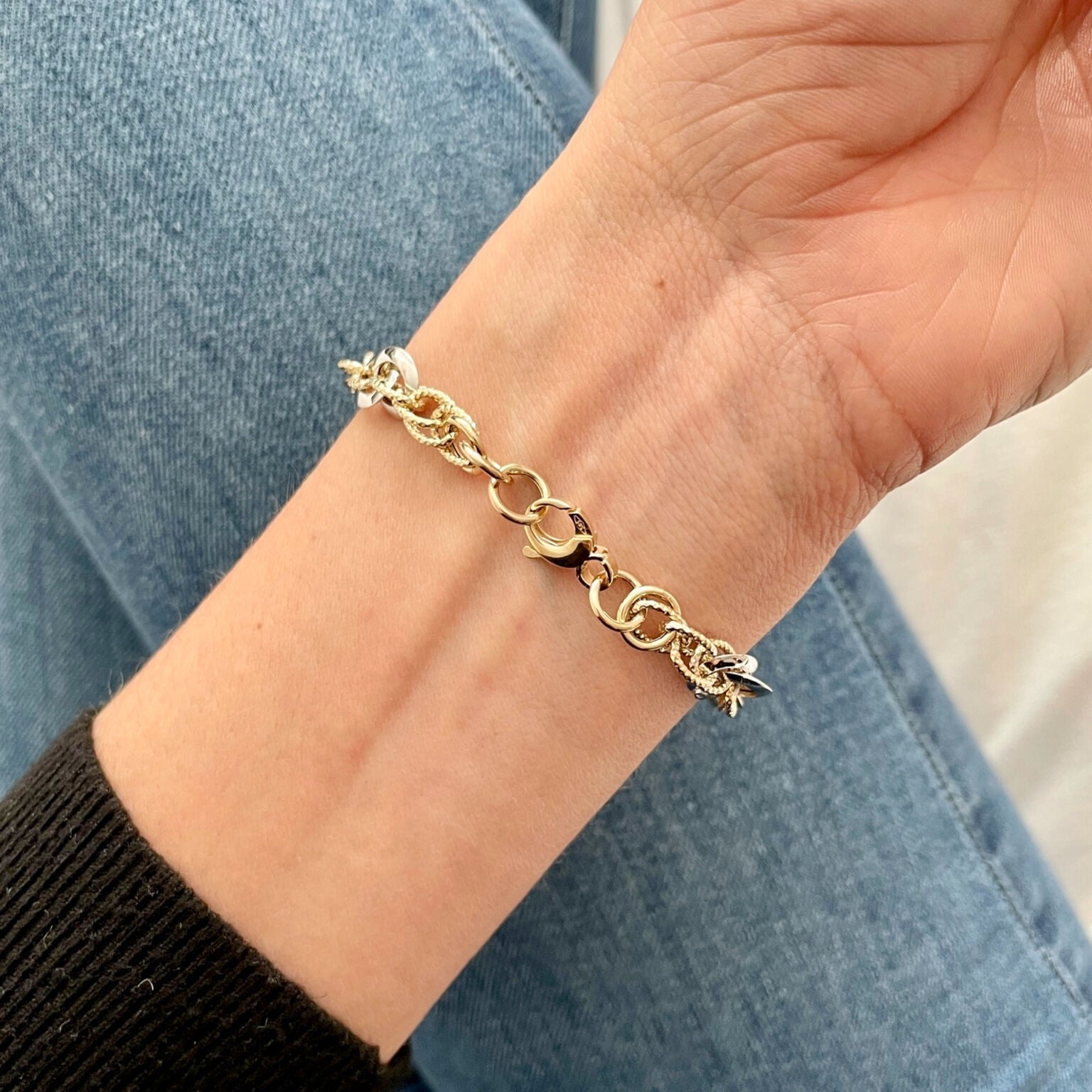 14K Two-Tone Gold Bracelet paired with blue denim, perfect for a relaxed yet stylish look suitable for daytime outings or casual gatherings.