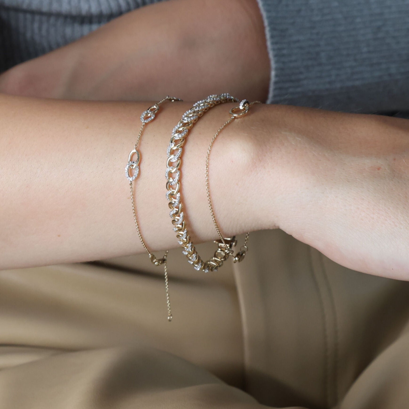 Styled with layered gold necklaces and rings, this 14K Yellow Gold Diamond Bracelet elevates the entire ensemble. Its timeless curb link design makes it perfect for a night out or a romantic evening, adding shine and sophistication to any attire.