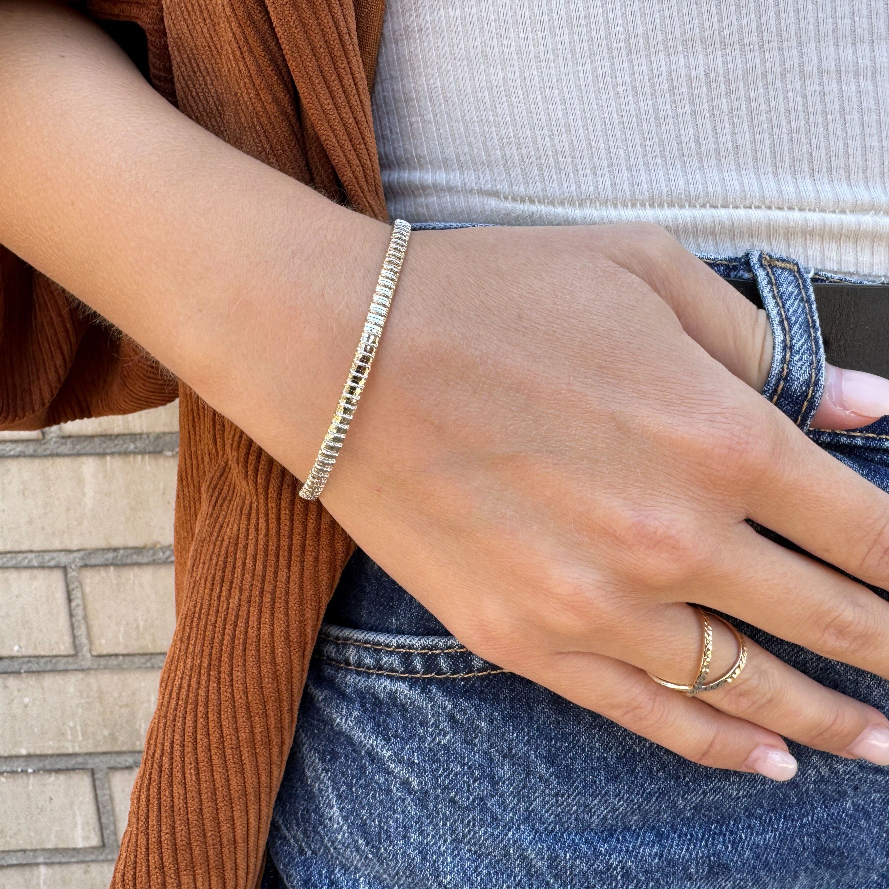 14K gold bracelet with white inlays designed for elegant shimmer and comfort.