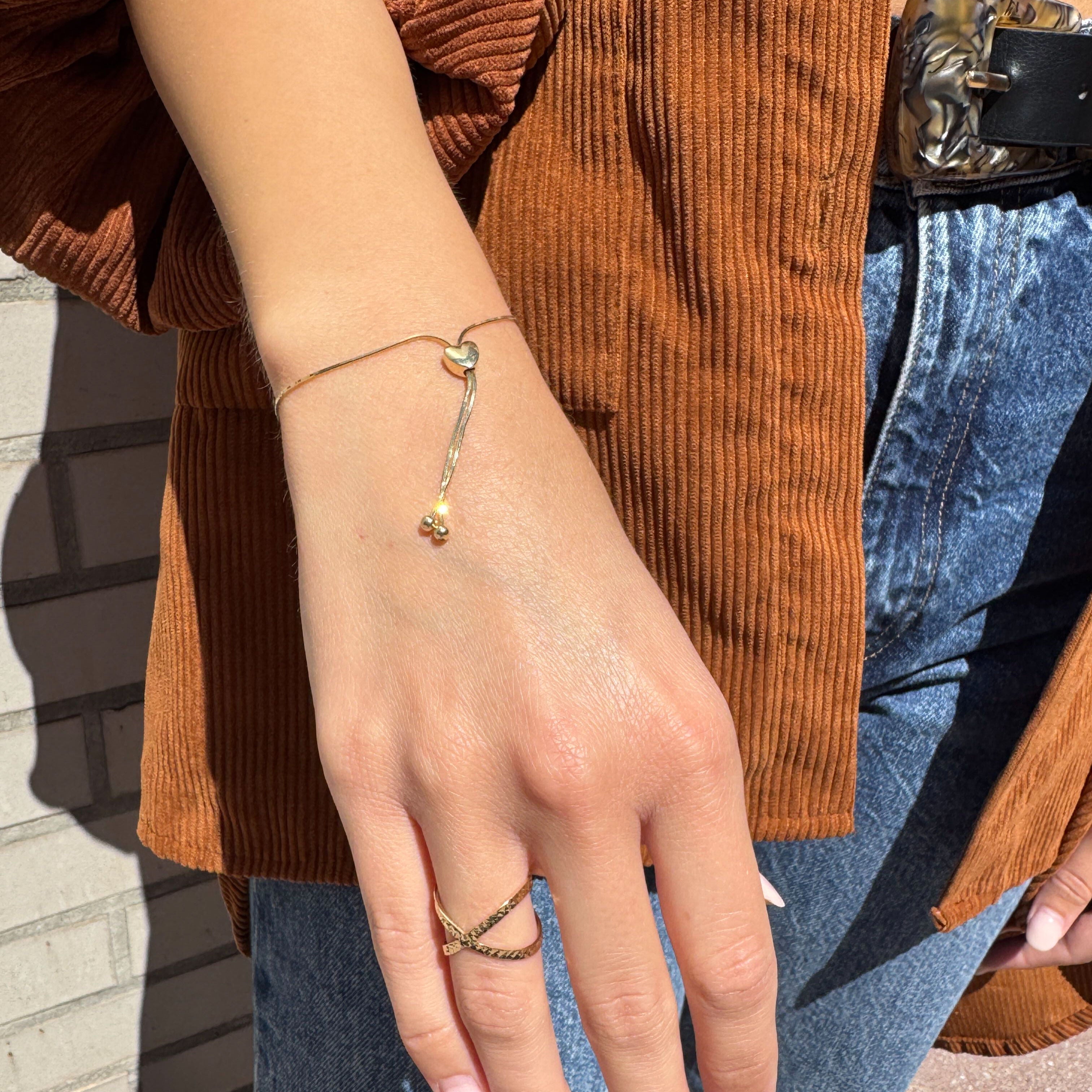 Heart Bracelet glowing in natural sunlight, styled with everyday wear, suitable for spring walks, dates, or daytime gifting moments