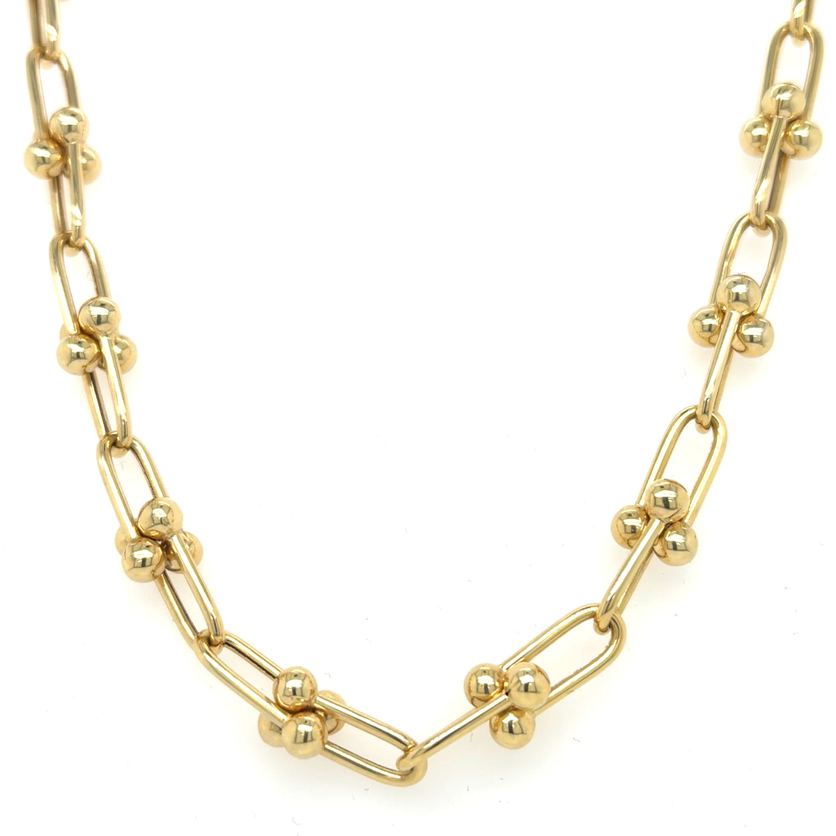 A 14K yellow gold u-link chain necklace featuring alternating elongated oval links and short sections of polished ball links, displayed on a clean white background.