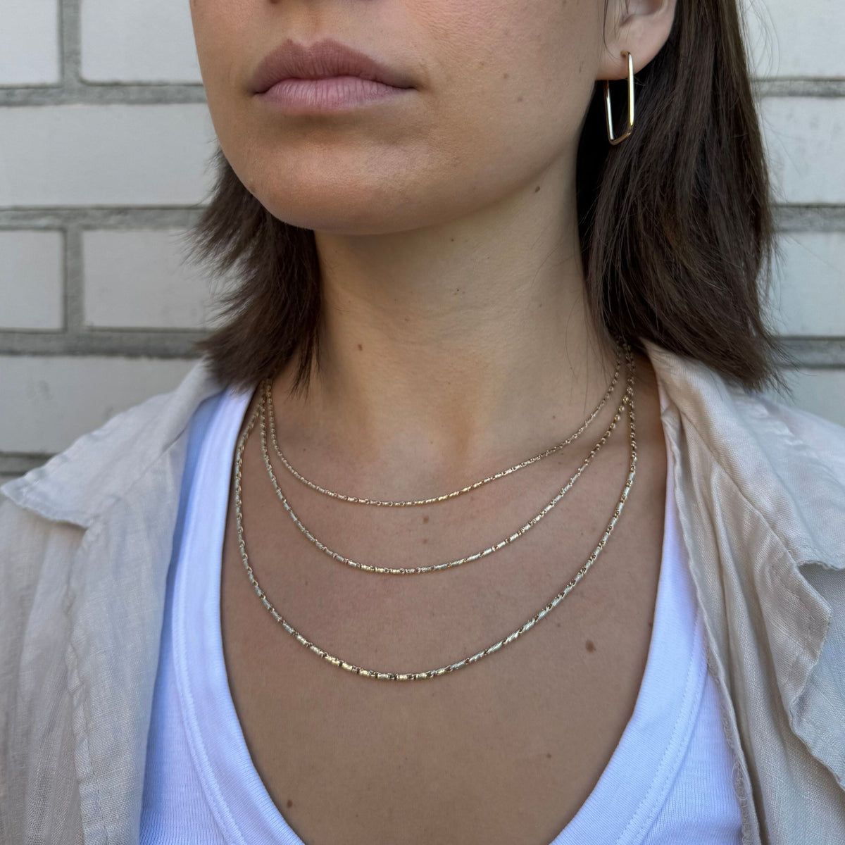 14K Yellow Gold Twisted Lumina Bar Link Necklace, Available in 1.5mm, 1.7mm and 2.1mm widths, with lengths from 18" to 24". The necklace is finished with a secure lobster clasp and also looks great layered with other gold chains.