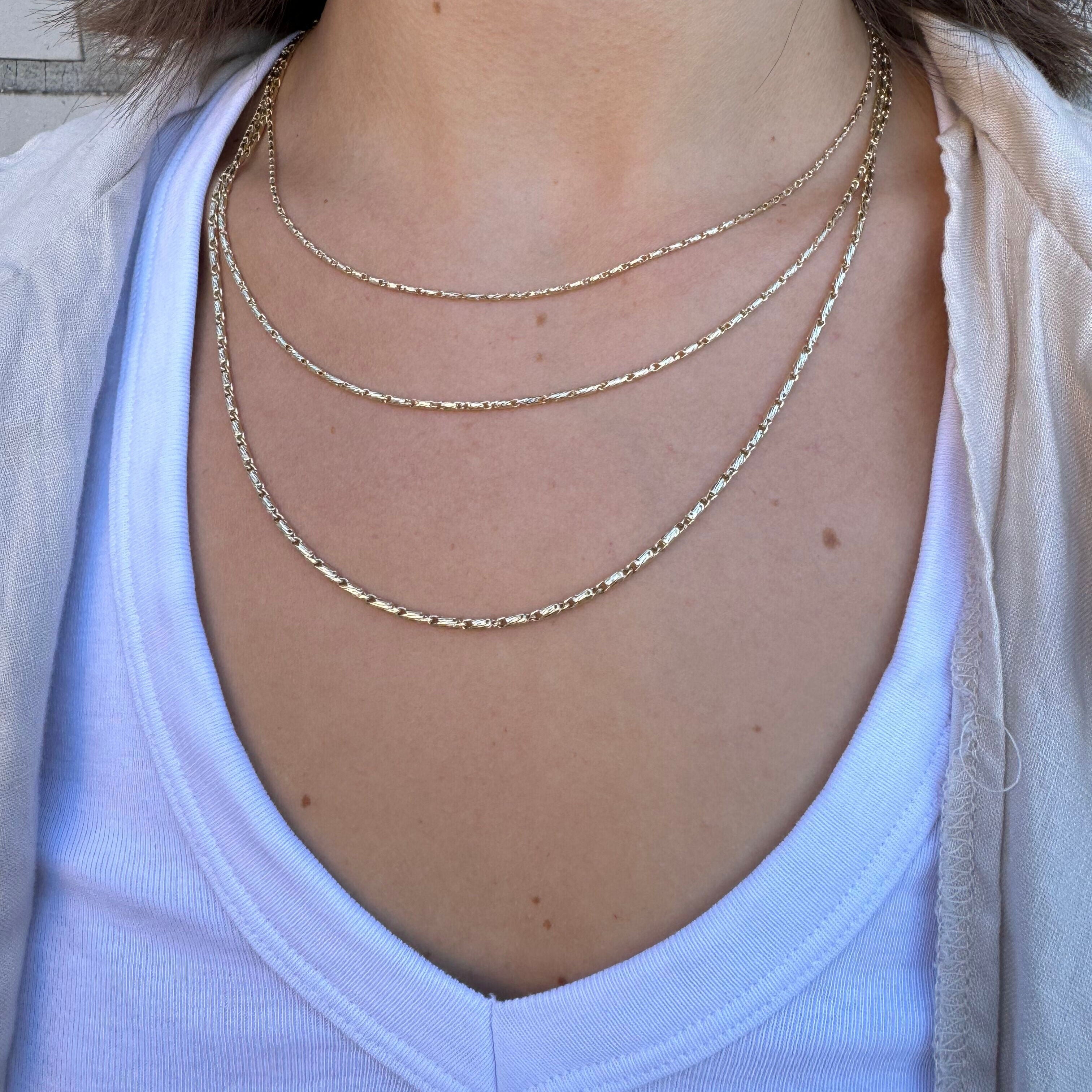 14K Yellow Gold Twisted Lumina Bar Link Necklace, Available in 1.5mm, 1.7mm and 2.1mm widths, with lengths from 18" to 24". The necklace is finished with a secure lobster clasp and also looks great layered with other gold chains.