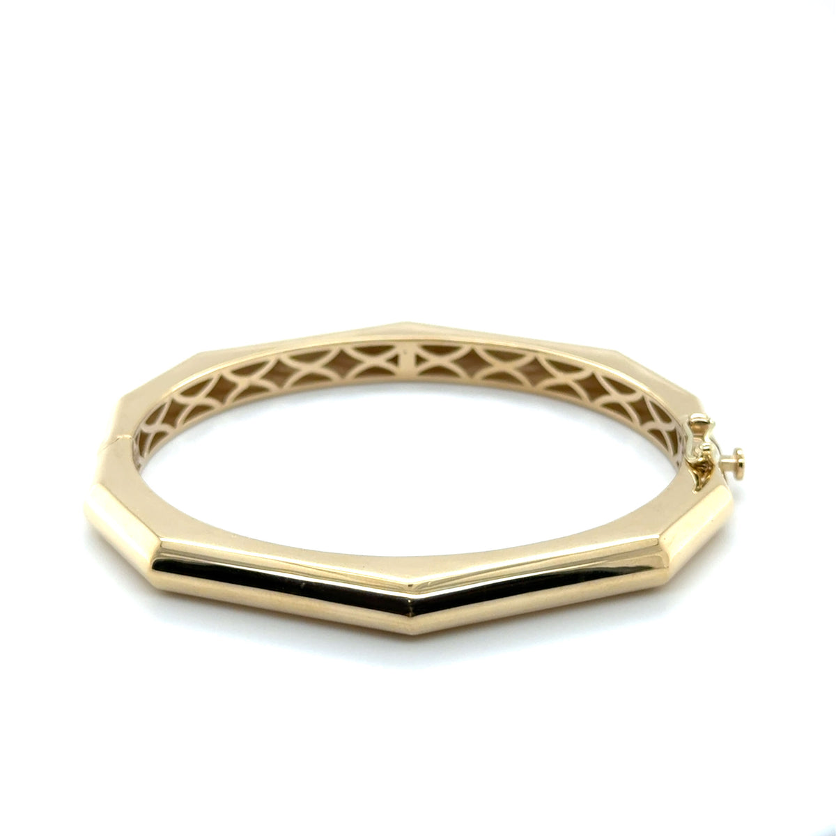 14K yellow gold octagonal hinged bangle bracelet with high-polish finish and eight angled sides