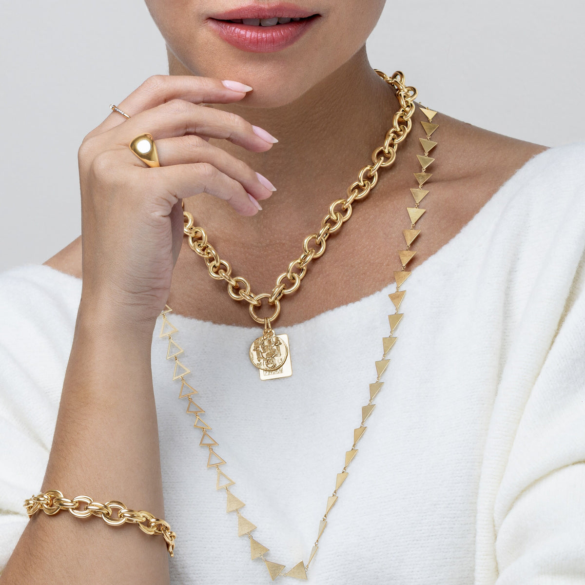 14K Yellow Gold Venetian Coin Medallion Pendant hanging from 14K yellow gold chunky charm holder rolo necklace