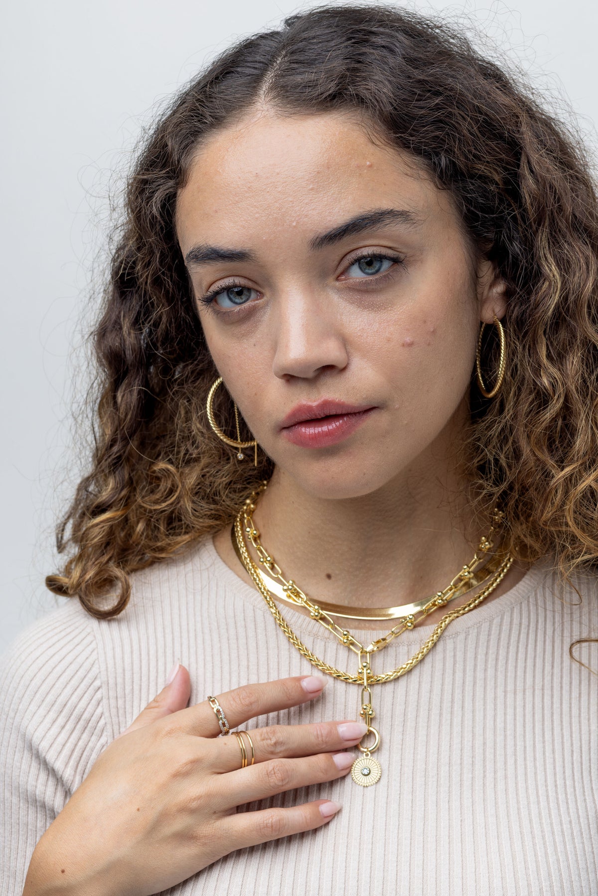 Close-up: 14K yellow gold U-link necklace, 5.5mm polished elongated links, rounded bead accents, 18-inch convertible Y chain