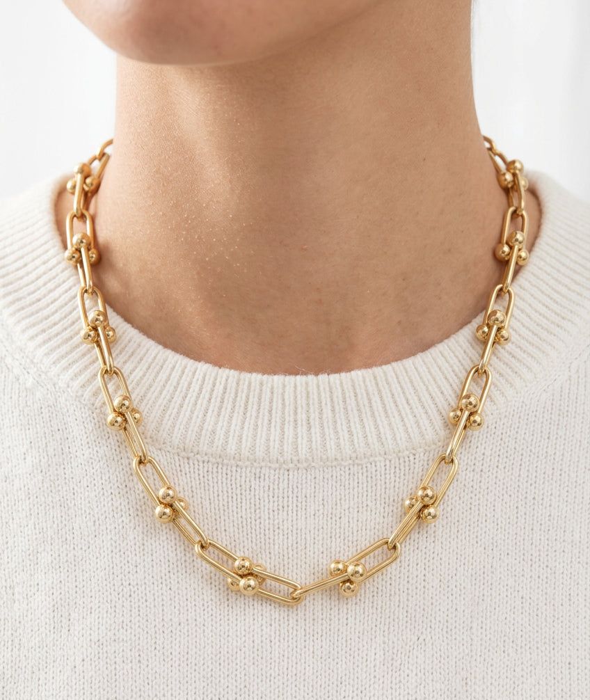 14K yellow gold U-link necklace, 5.5mm polished elongated links with rounded bead accents, 18-inch convertible Y chain