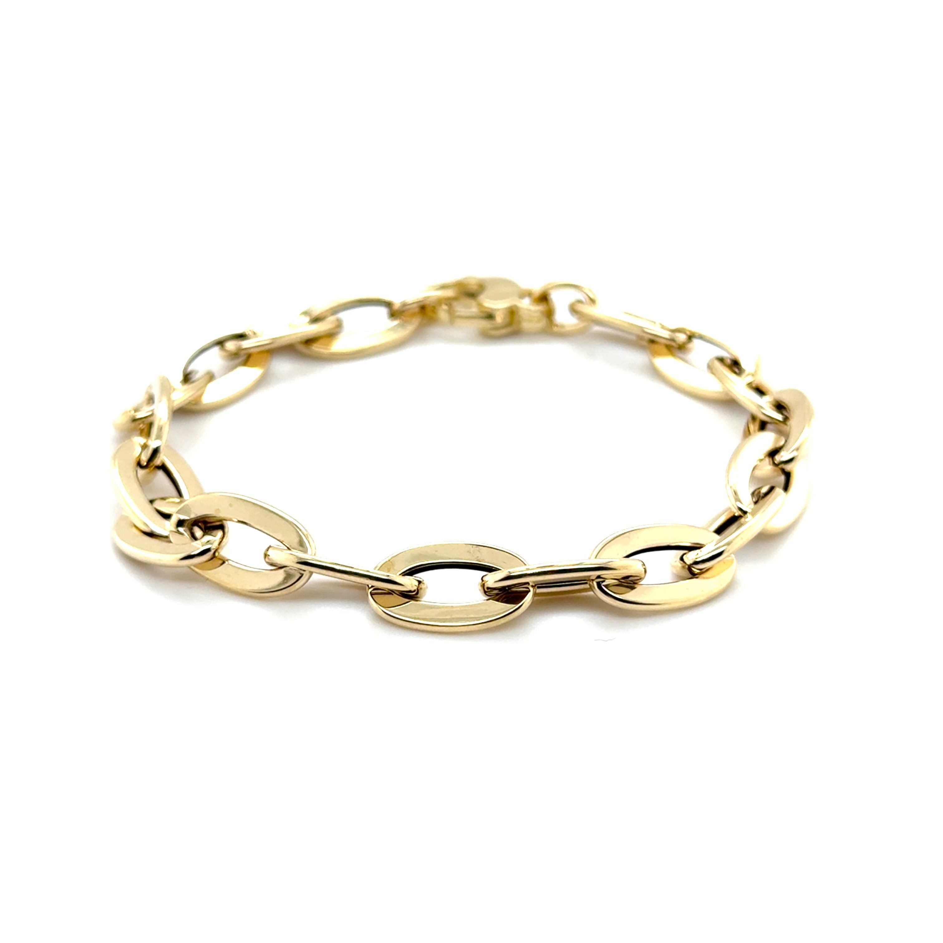 Elegant 14K yellow gold flat oval link bracelet with a polished finish, designed for durability and comfort. This bold yet timeless jewelry piece is versatile for birthdays, anniversaries, weddings, or everyday wear, making it a thoughtful and stylish gift.