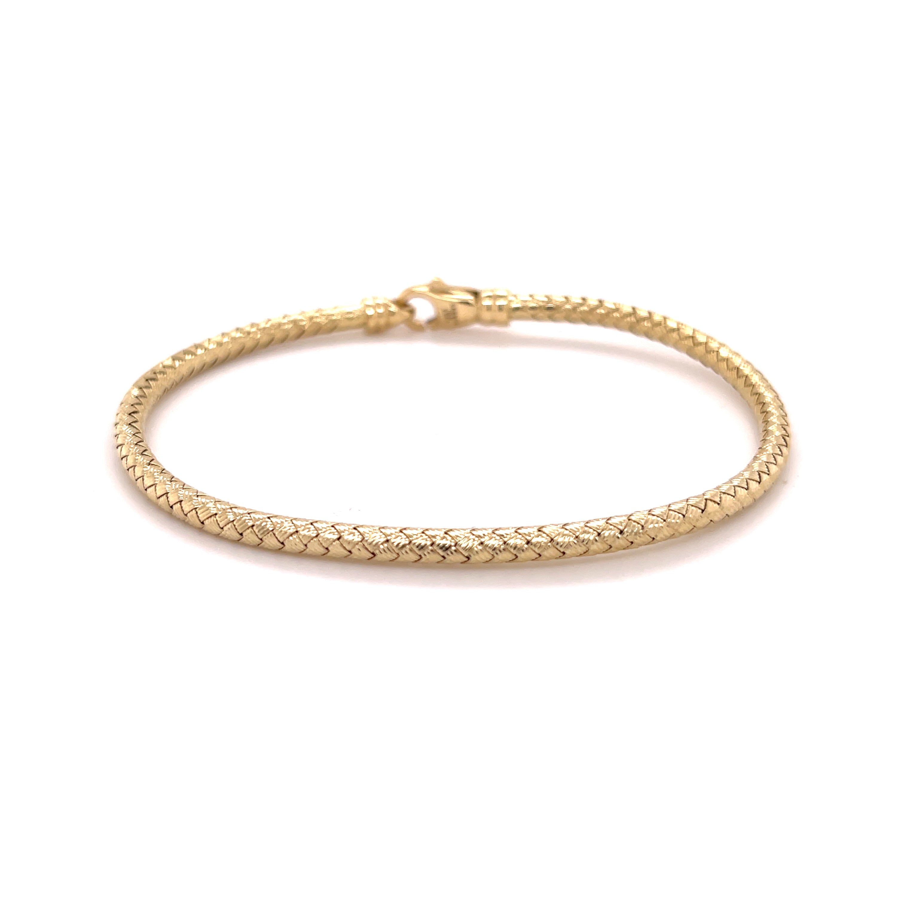 Elegant 14K yellow gold woven bangle bracelet with an intricate braided texture, offering timeless craftsmanship and lasting brilliance. Comfortable, durable, and versatile, it makes a refined fine jewelry gift for birthdays, anniversaries, weddings, and milestone celebrations.