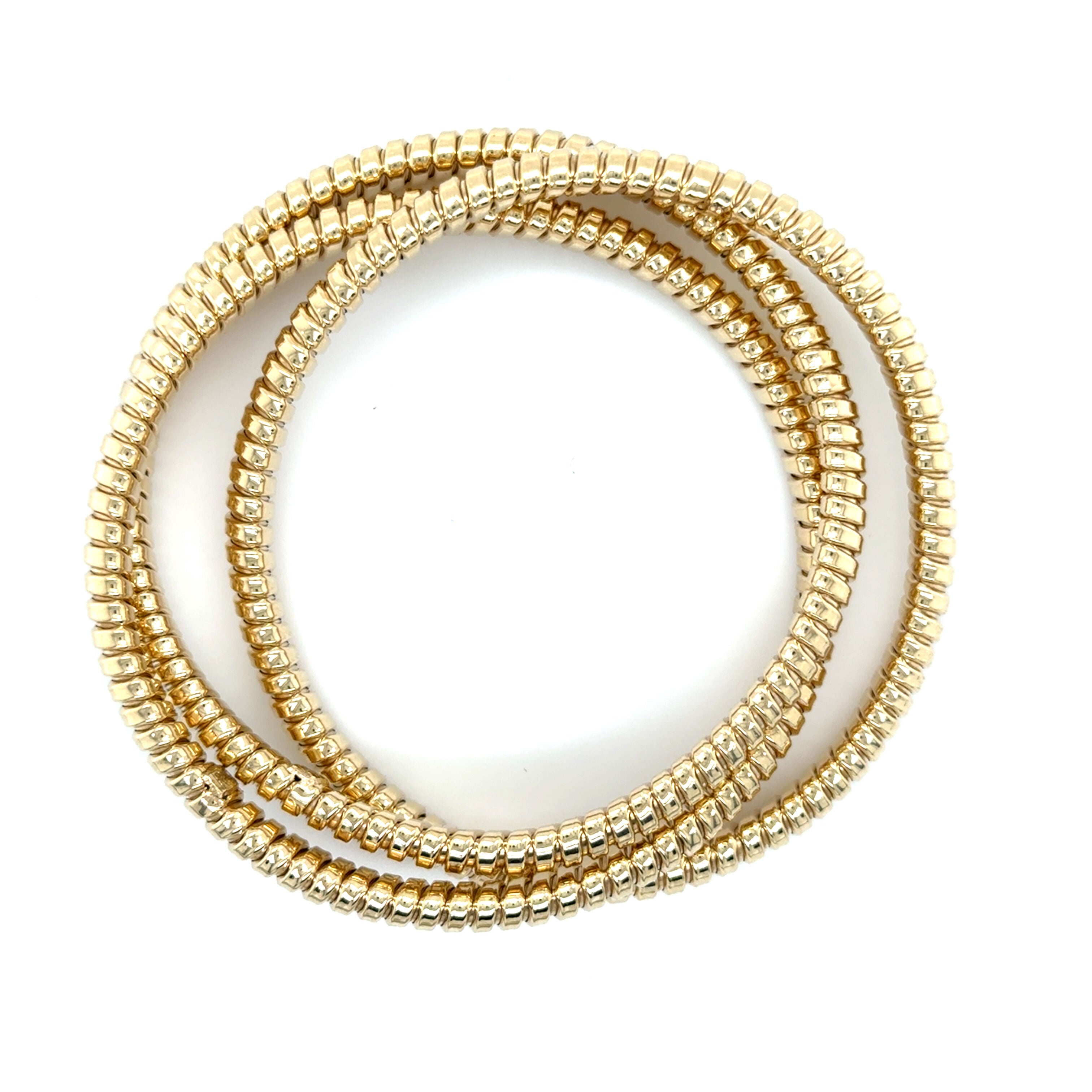 14K yellow gold Tubogas bangle with a polished coiled design, offering timeless elegance and everyday comfort. Substantial yet flexible, this bold bracelet is perfect for birthdays, anniversaries, milestone celebrations, or as a versatile luxury accessory.