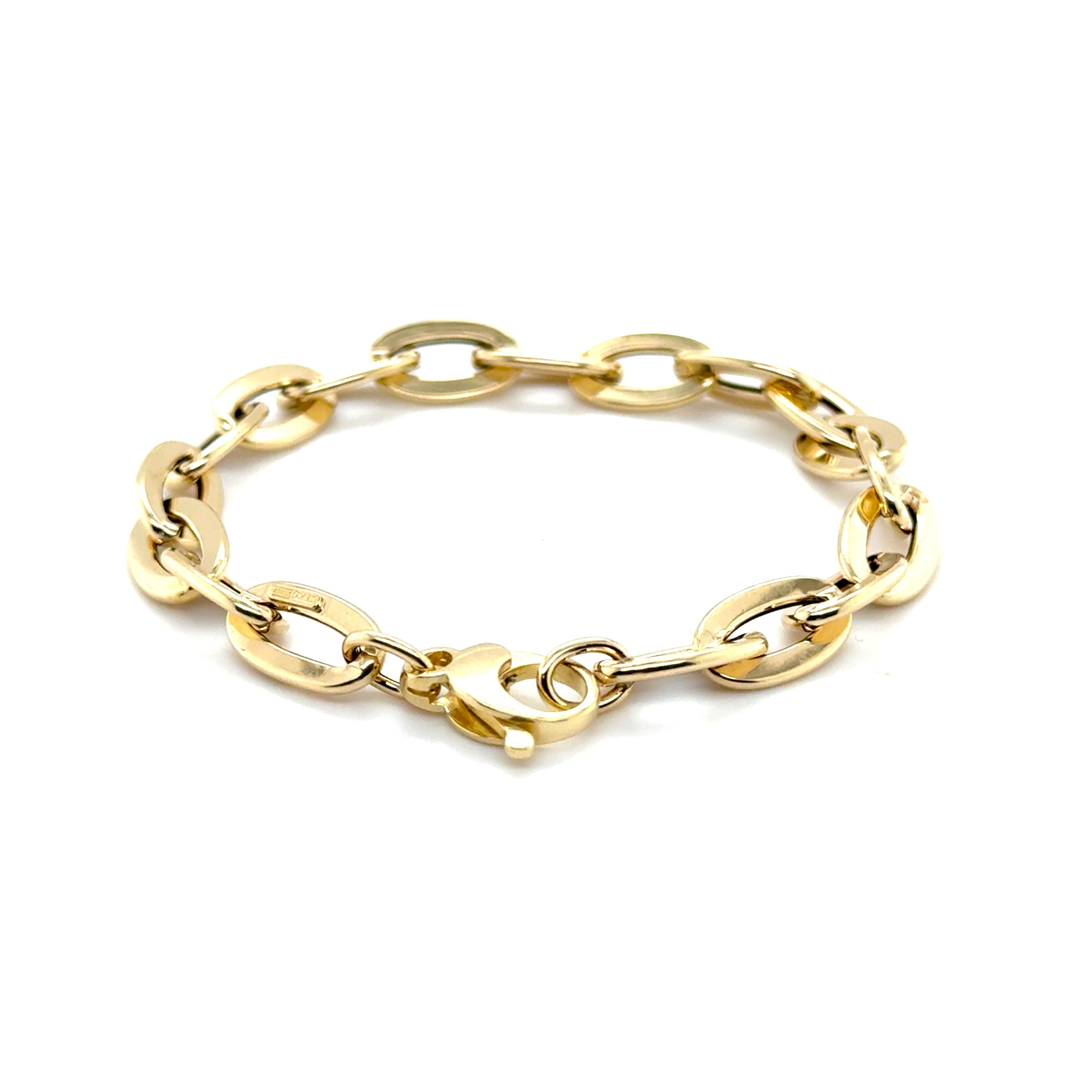 Elegant 14K yellow gold flat oval link bracelet with a polished finish, designed for durability and comfort. This bold yet timeless jewelry piece is versatile for birthdays, anniversaries, weddings, or everyday wear, making it a thoughtful and stylish gift.