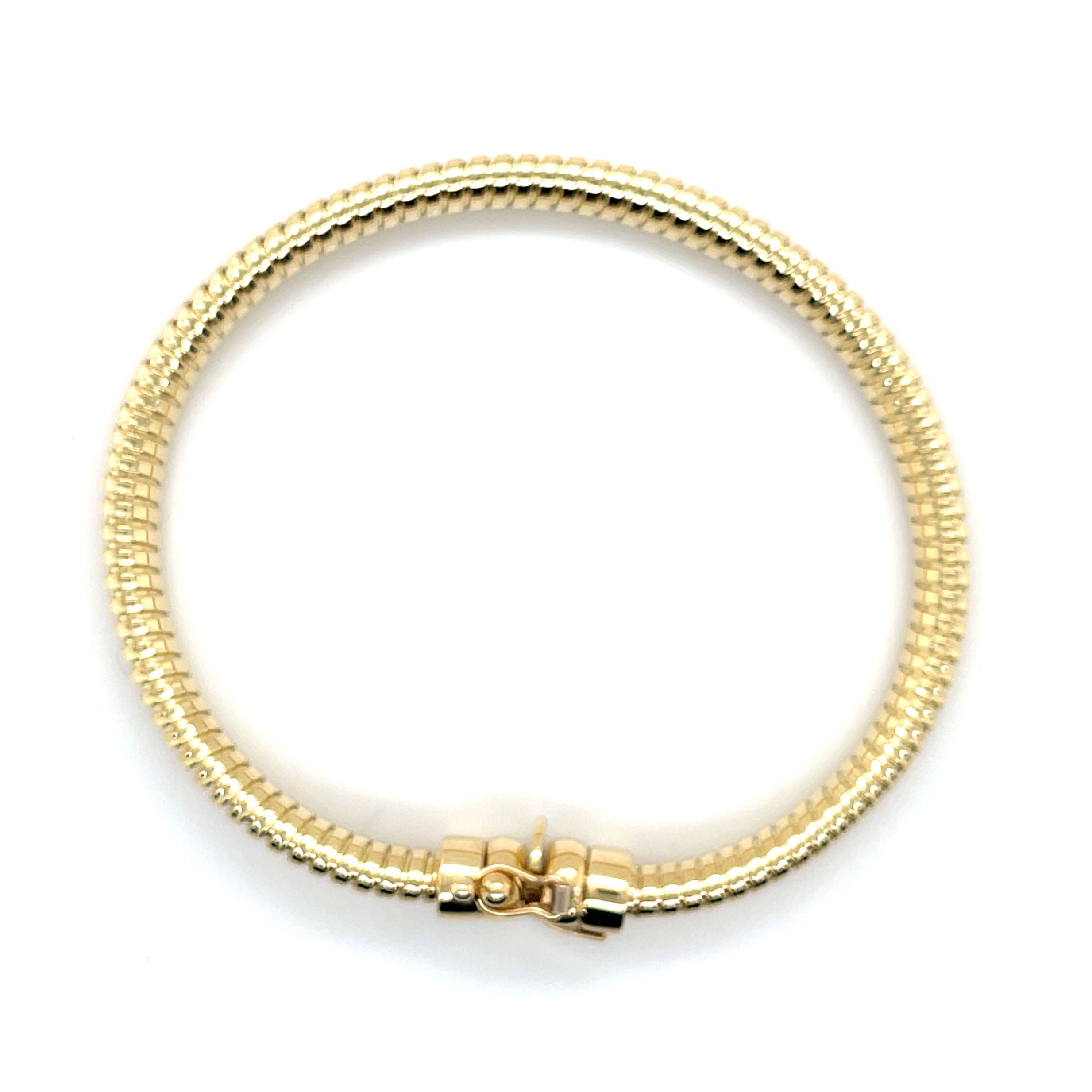 Elegant 14K yellow gold Tubogas bracelet with a polished coil design that is durable, versatile, and timeless. A luxury jewelry piece perfect for everyday wear, birthdays, anniversaries, or milestone celebrations, offering both comfort and sophistication.