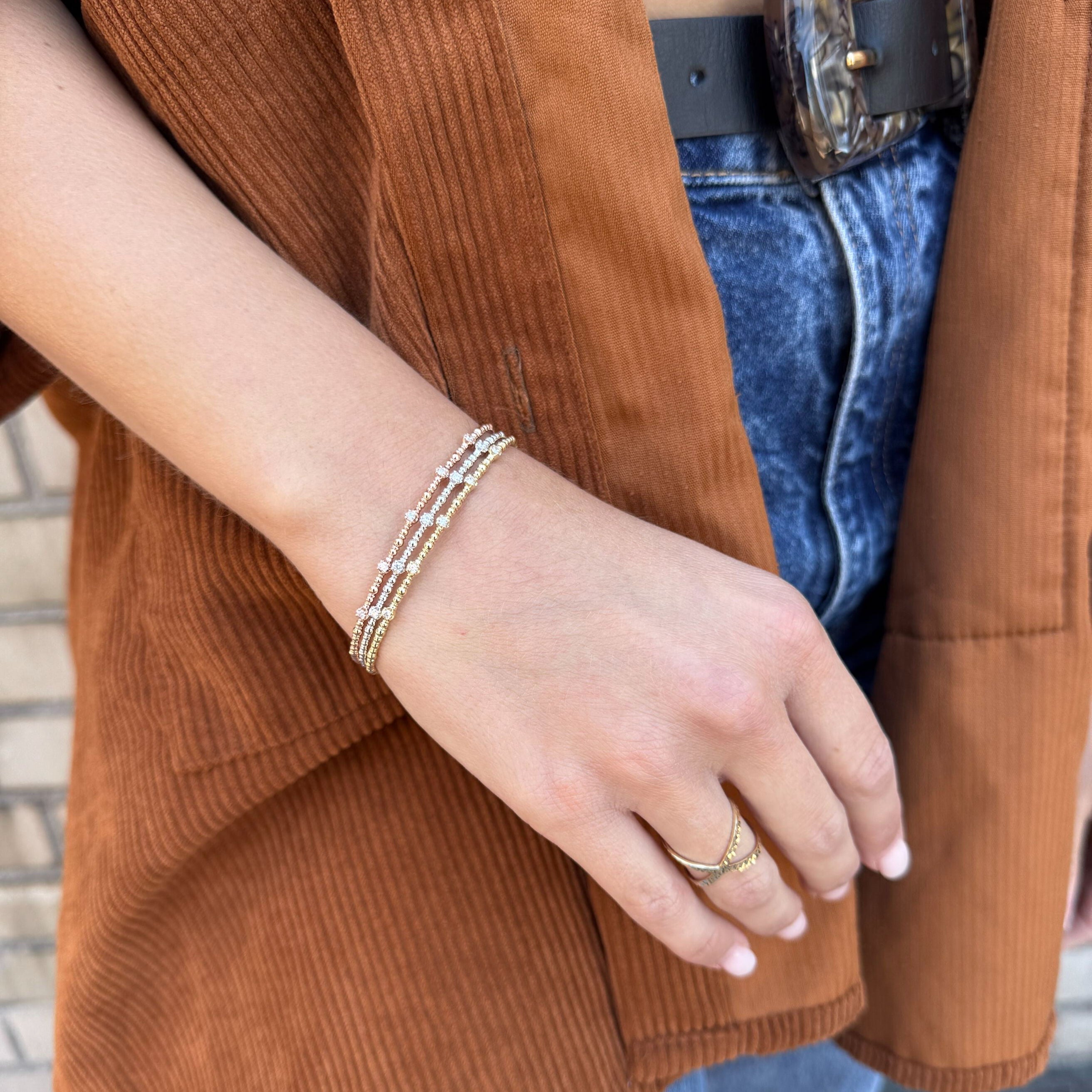 Gold bracelet featuring natural diamonds in stylish beaded form