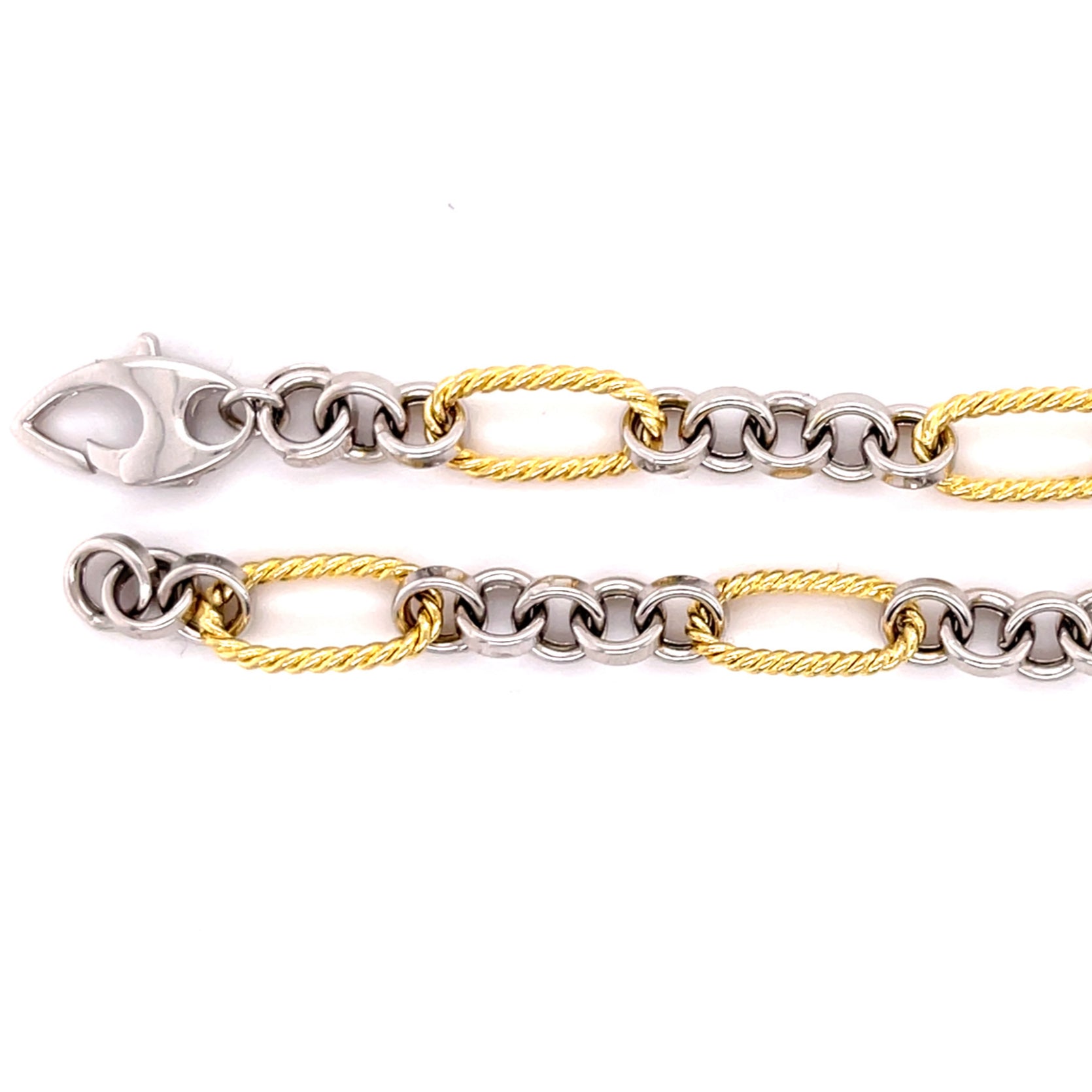 14K solid gold two tone bracelet featuring alternating yellow gold oval links and polished white gold round links for a refined contrast. With a classic lobster claw clasp, this durable and tarnish-resistant bracelet is versatile enough for everyday wear and elegant enough for special occasions. A timeless gift for birthdays, anniversaries, weddings, or milestone celebrations.