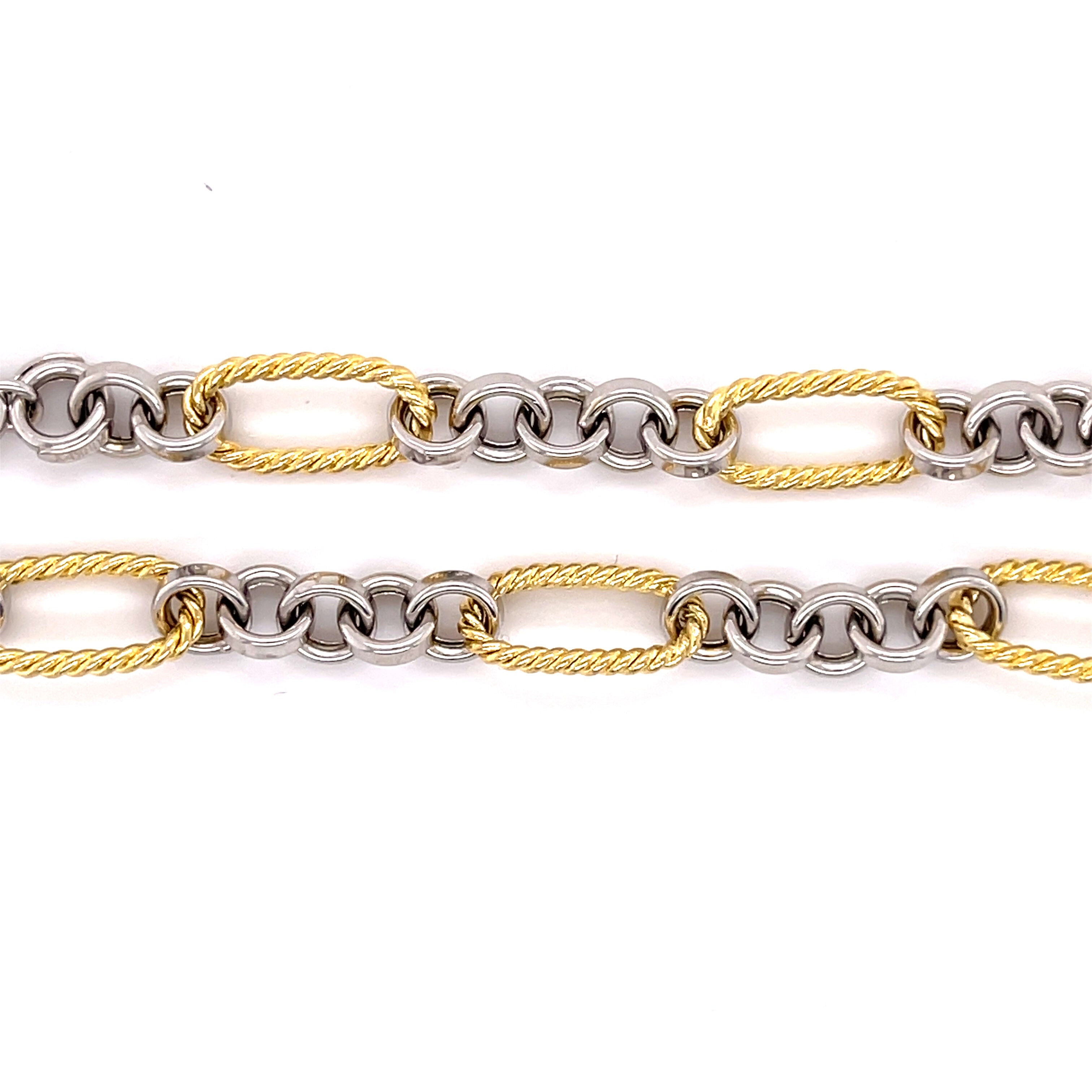 14K solid gold two tone bracelet featuring alternating yellow gold oval links and polished white gold round links for a refined contrast. With a classic lobster claw clasp, this durable and tarnish-resistant bracelet is versatile enough for everyday wear and elegant enough for special occasions. A timeless gift for birthdays, anniversaries, weddings, or milestone celebrations.