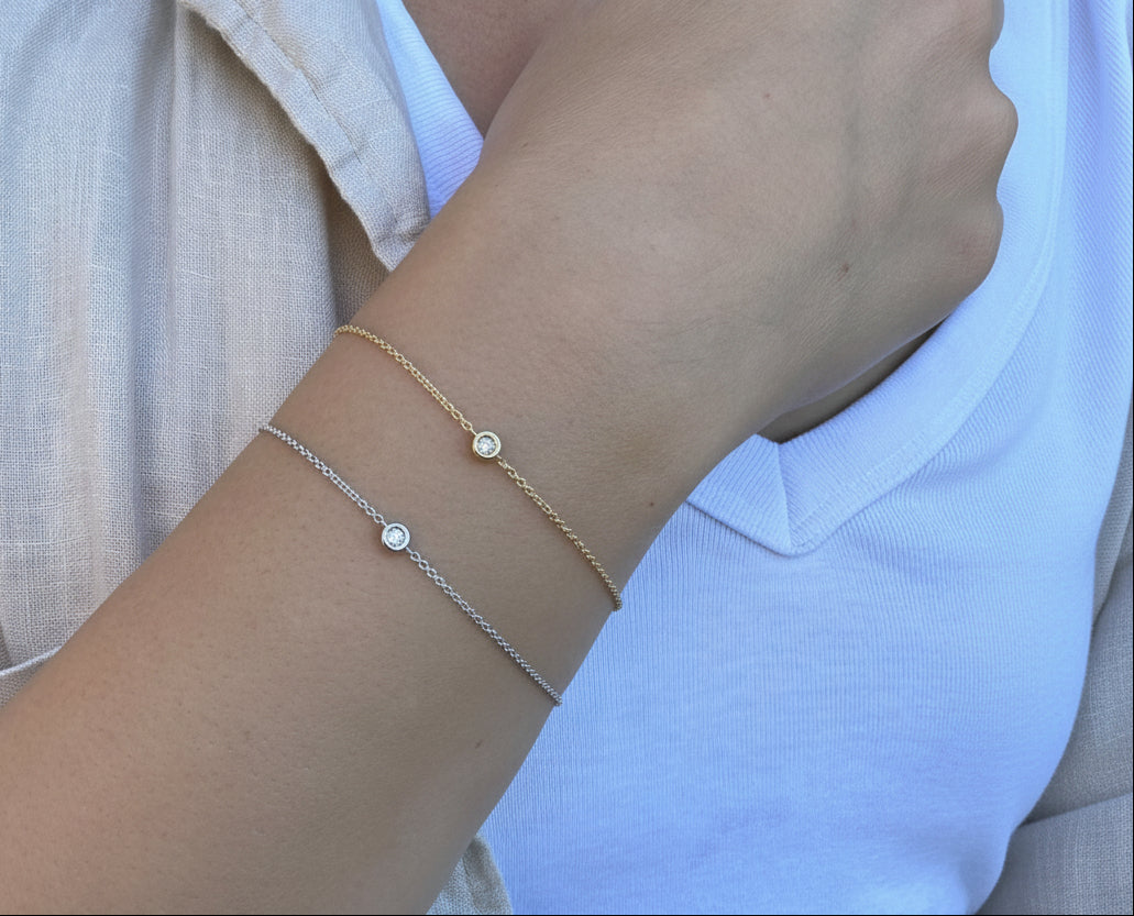 Diamond Bezel Bracelet in 14K rose gold worn with a light linen shirt, creating a soft feminine look that radiates charm and clarity, ideal for brunch dates, anniversaries, and daytime events.