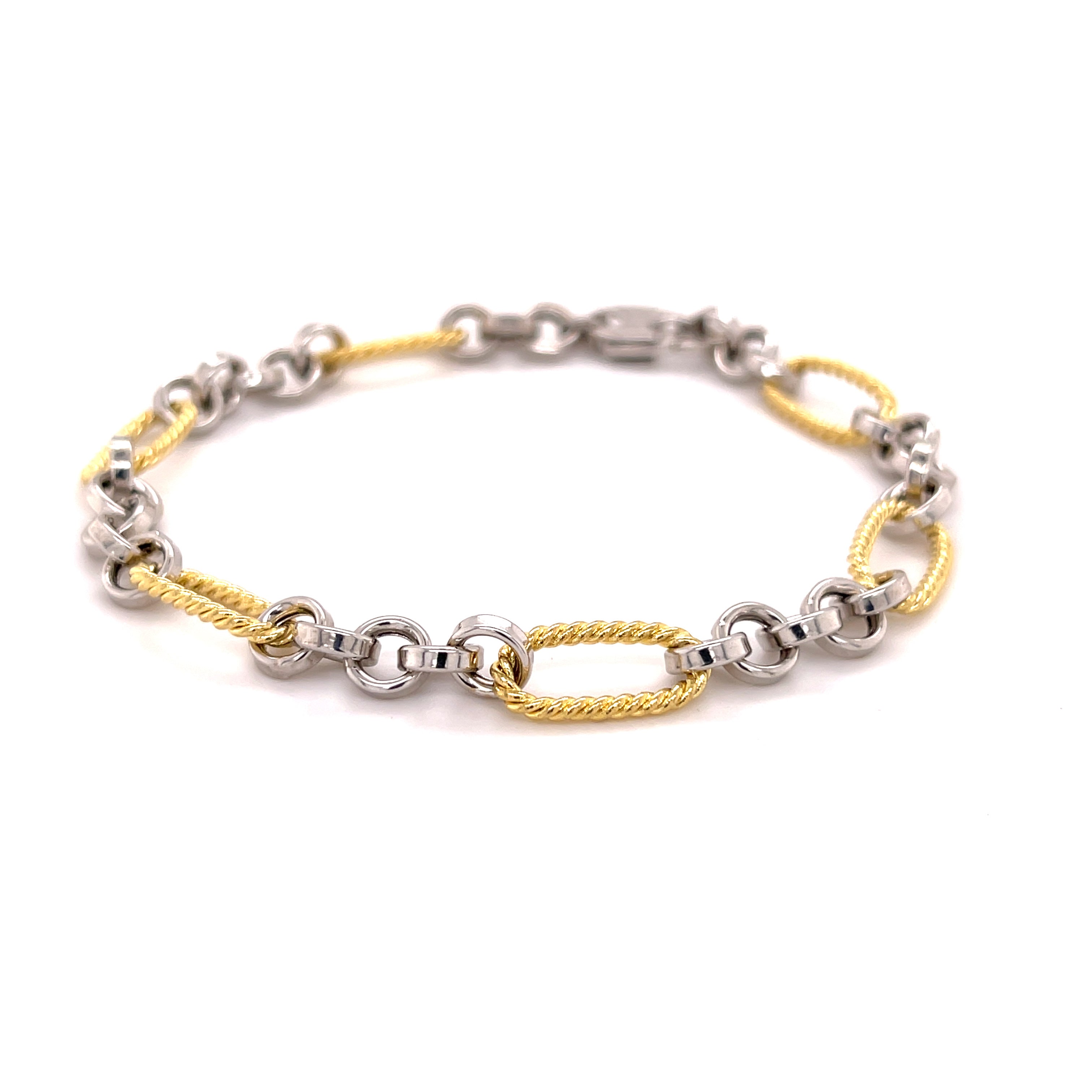 14K solid gold two tone bracelet featuring alternating yellow gold oval links and polished white gold round links for a refined contrast. With a classic lobster claw clasp, this durable and tarnish-resistant bracelet is versatile enough for everyday wear and elegant enough for special occasions. A timeless gift for birthdays, anniversaries, weddings, or milestone celebrations.