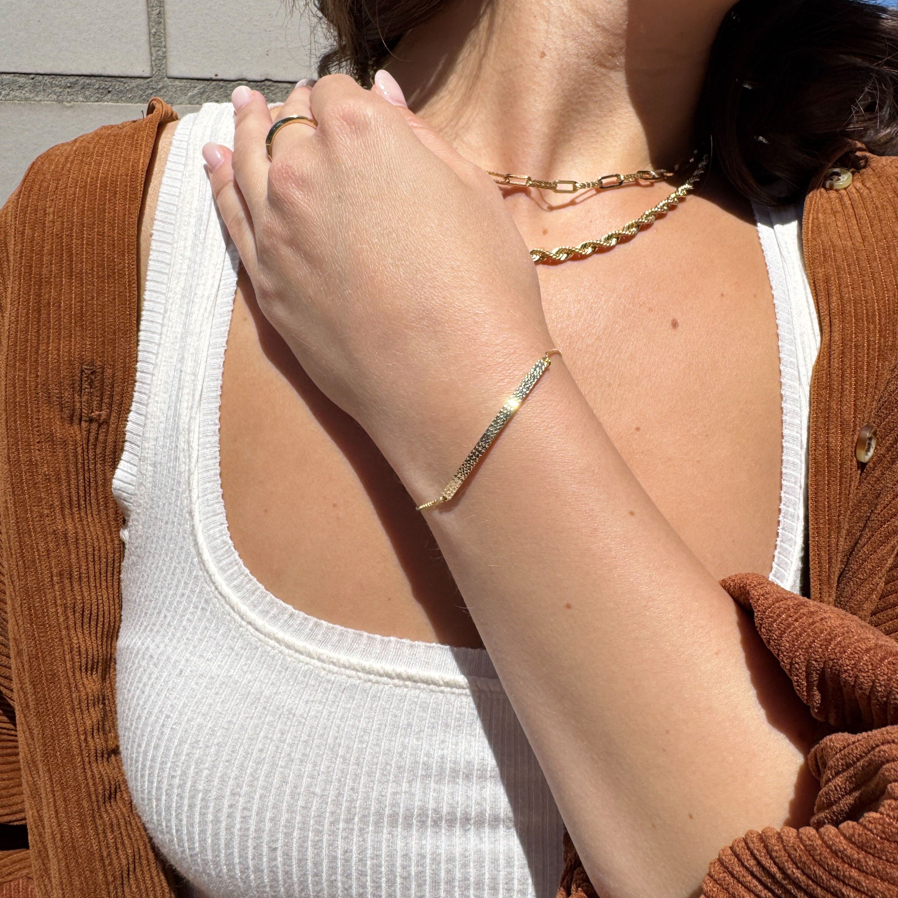 Lightweight Gold Bracelet styled with a white scoop tank and natural light, ideal for spring walks, birthdays or soft-style gifting moments