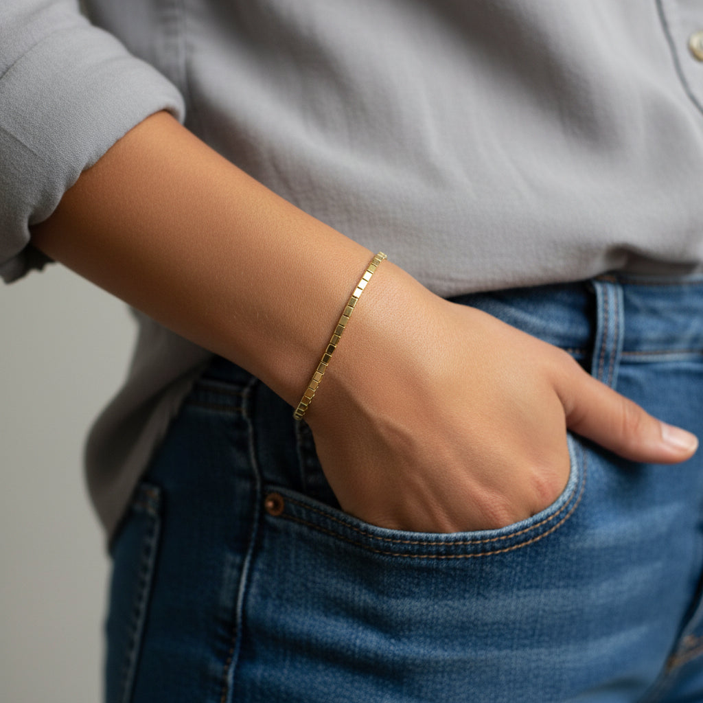 A timeless and elegant gold chain bracelet with box links, perfect for everyday wear or special occasions. This durable and versatile bracelet is a stylish gift idea for birthdays, anniversaries, or milestone celebrations.