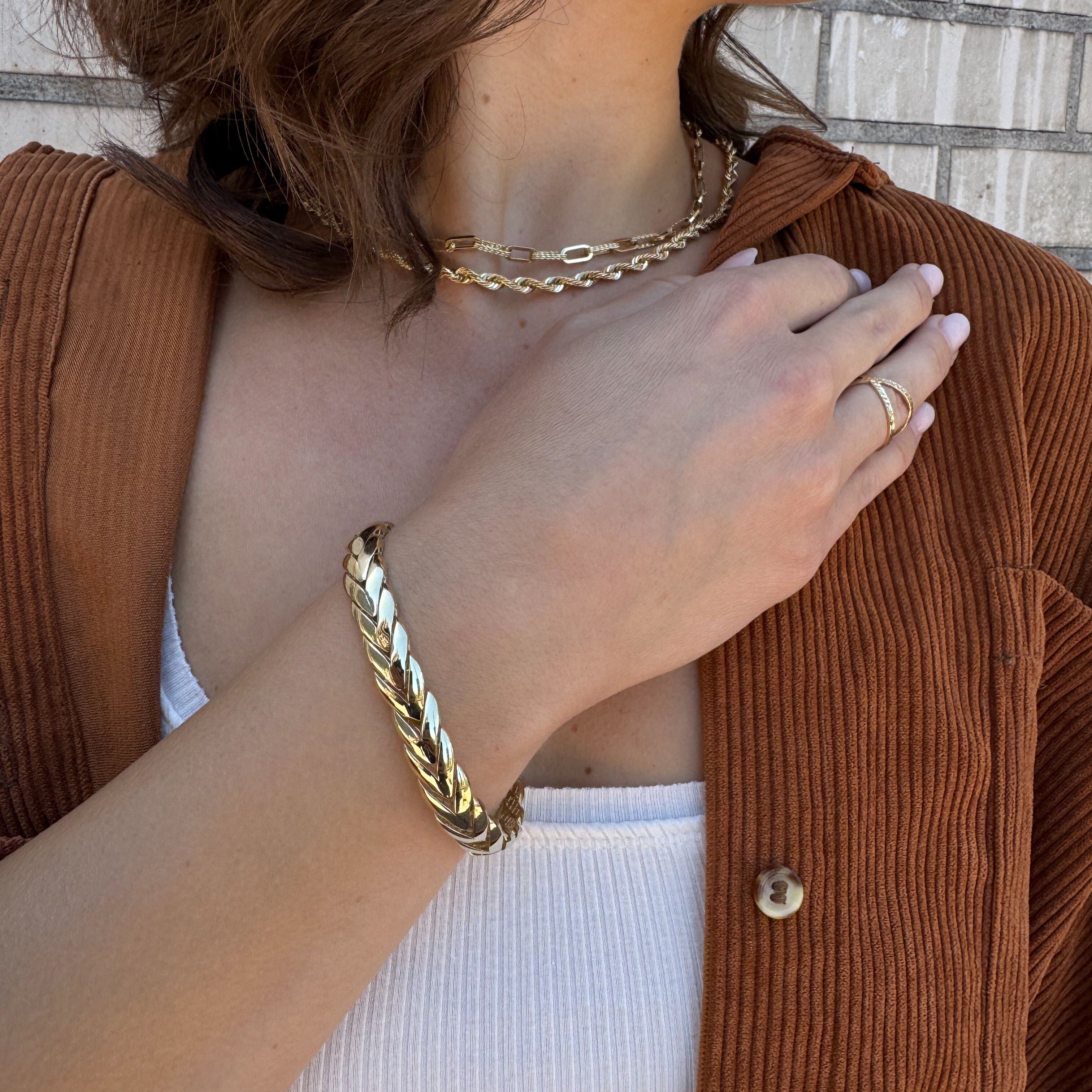 14K Gold Bold Bracelet styled with a white tank and gold jewelry stack, offering a clean yet striking outfit for daytime chic or outdoor gatherings
