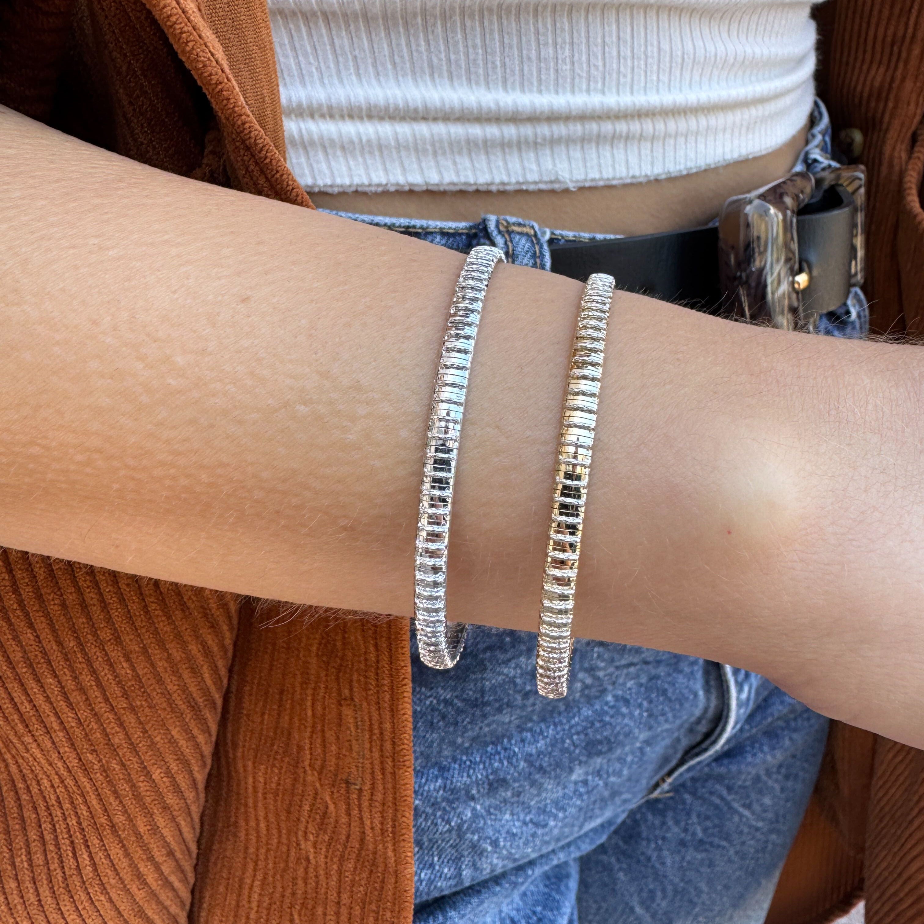 Two-tone gold ridged bracelet with subtle shimmer for fashion-forward wearers.