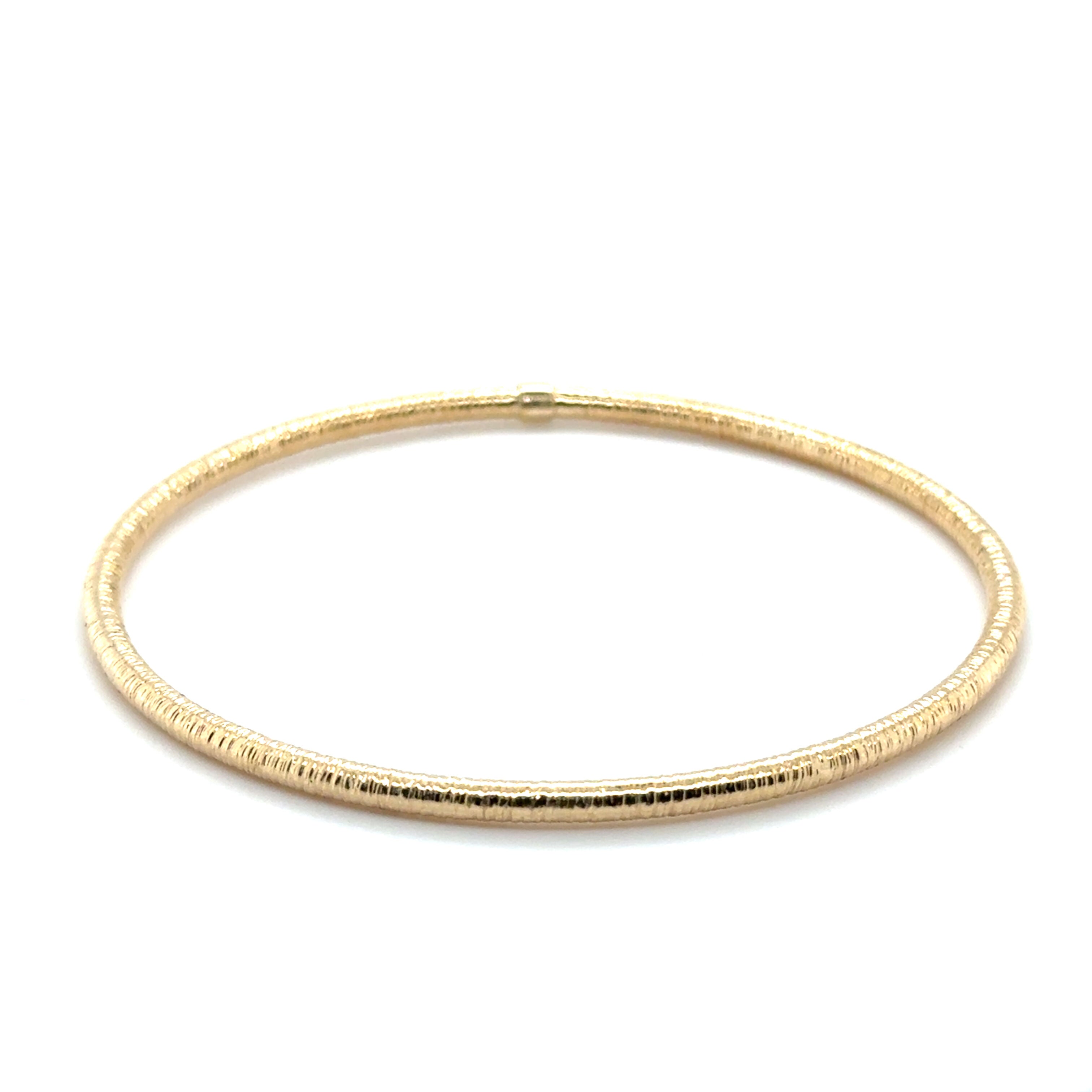 Lightweight and stackable 14K Gold Bangle with textured shine, ideal for mixing with other gold pieces, makes a timeless gift for any occasion.