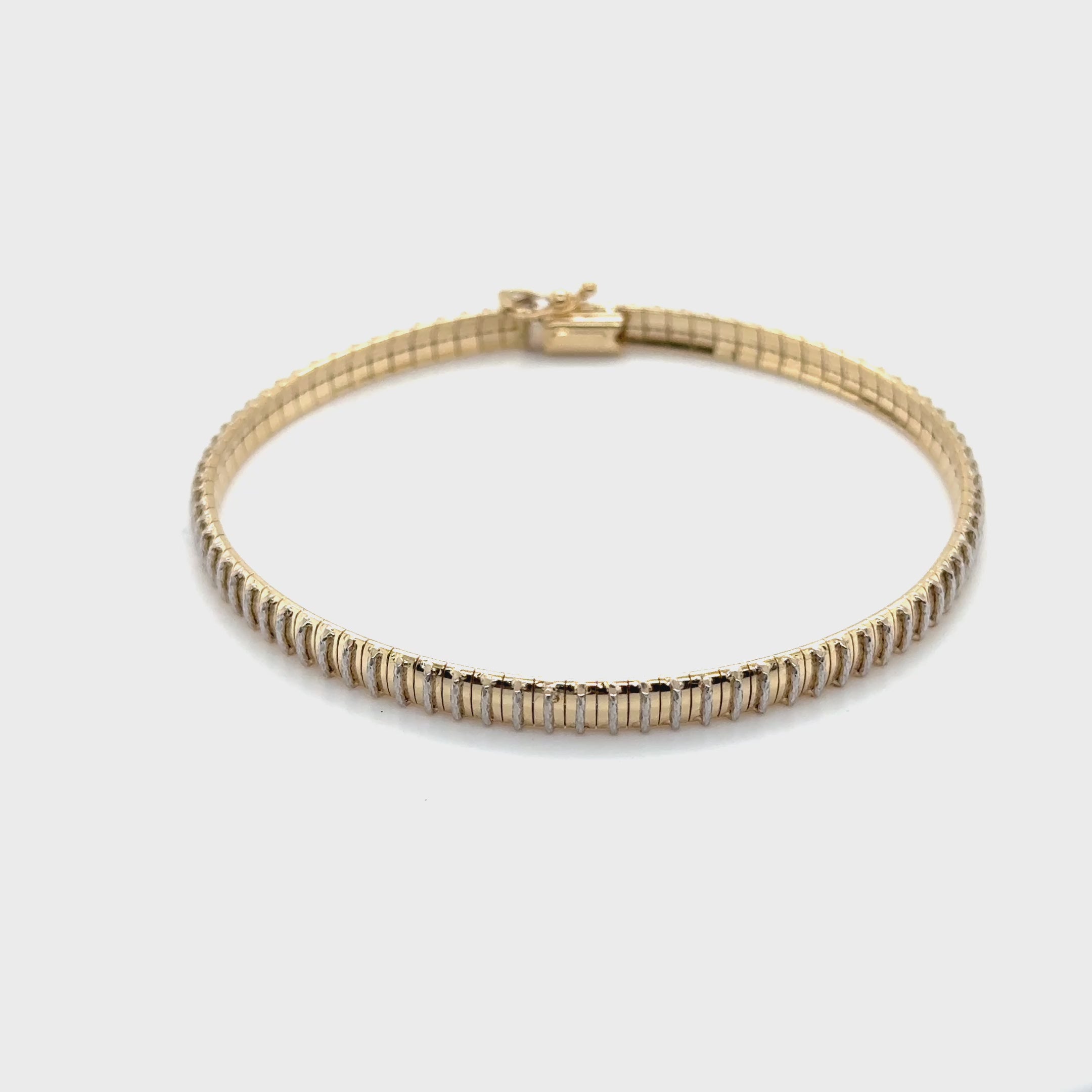 Diamond-cut gold bracelet offering brilliant shine for events or everyday style.