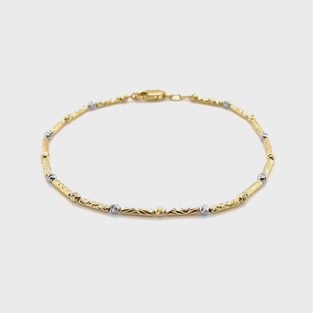 14K Two Tone Gold Bar and Bead Bracelet designed with a refined twist bar chain, offering durability, everyday elegance, and timeless sophistication for versatile styling.