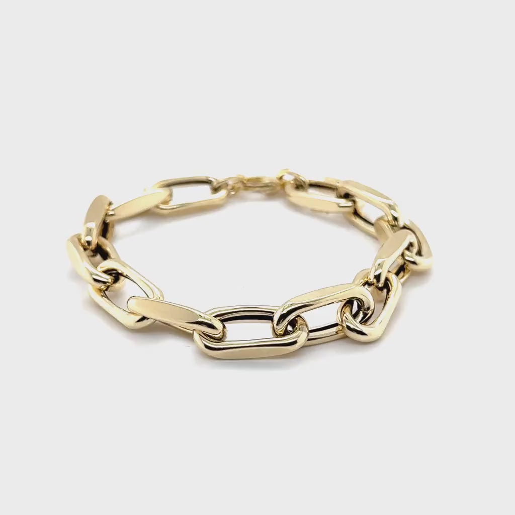 Bold 14K yellow gold chunky faceted cable link bracelet featuring 9mm thick links and a secure lobster clasp. This durable and polished chain bracelet offers timeless style, perfect for birthdays, anniversaries, weddings, or milestone celebrations.