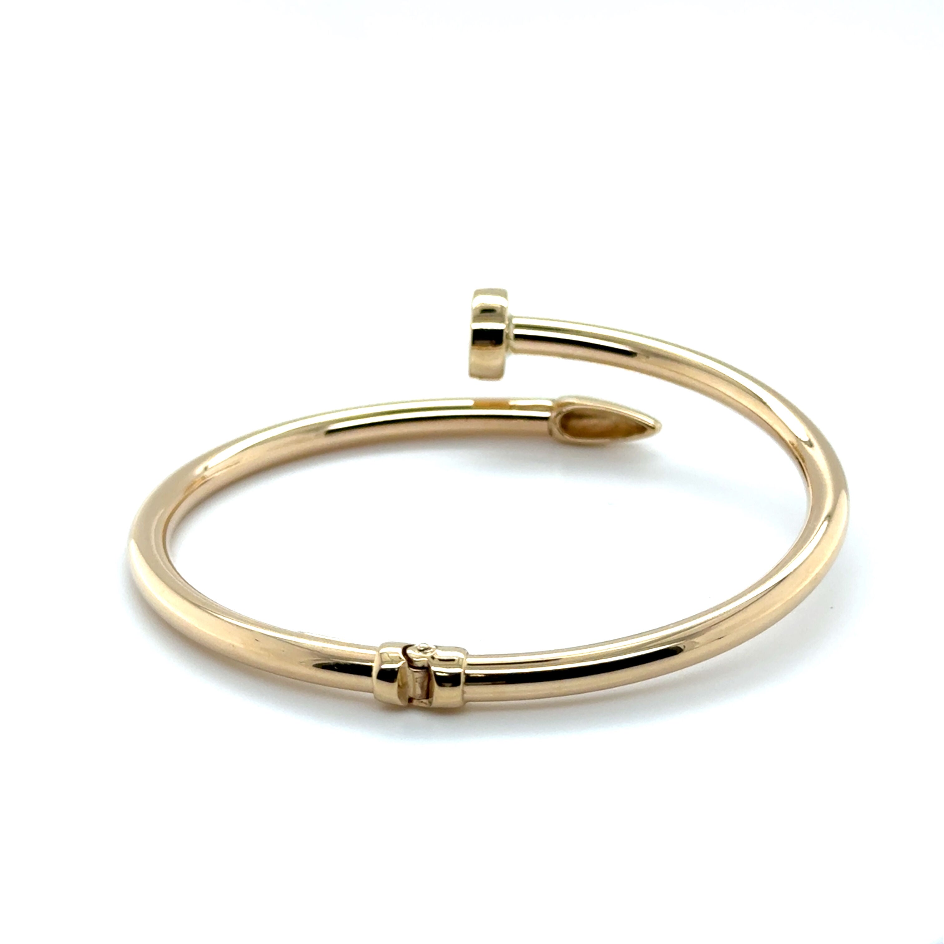 Sleek and sculptural 14K Gold Wrap Bangle with smooth curves, known for comfort and boldness, makes a lasting gift for birthdays and anniversaries.