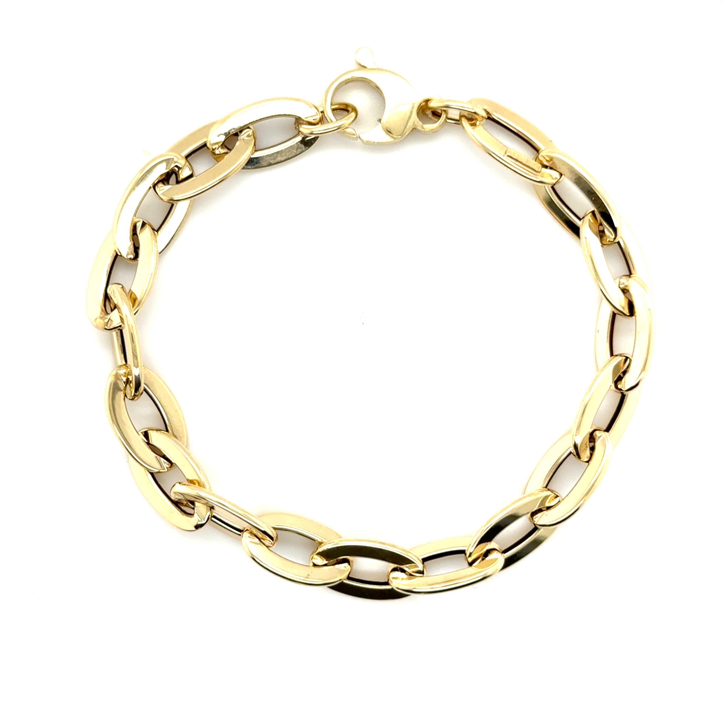 Elegant 14K yellow gold flat oval link bracelet with a polished finish, designed for durability and comfort. This bold yet timeless jewelry piece is versatile for birthdays, anniversaries, weddings, or everyday wear, making it a thoughtful and stylish gift.