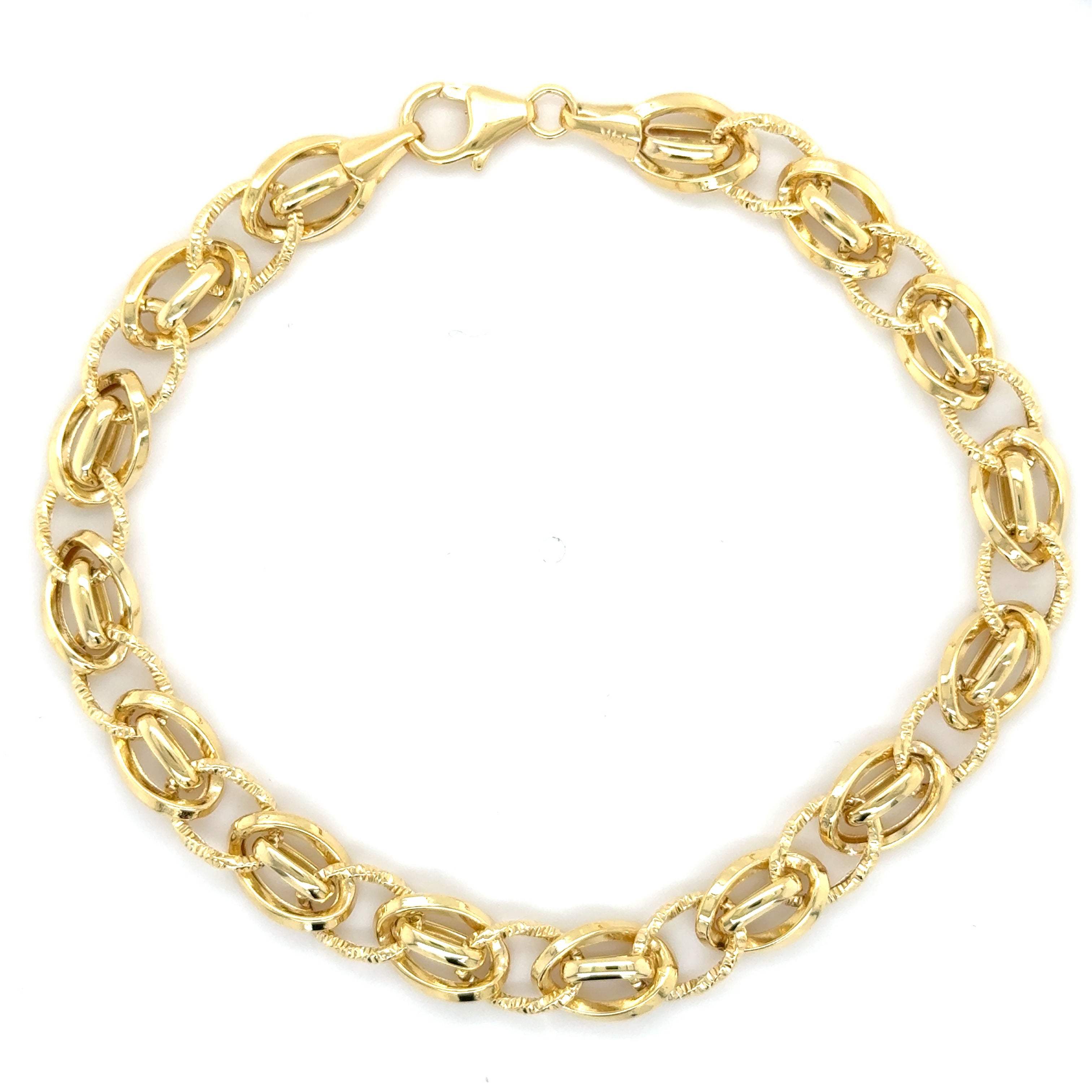 14K solid gold twisted oval link bracelet with polished, textured connectors, offering a bold yet elegant style. Durable and tarnish-resistant, this bracelet is perfect for everyday wear or evenings, and makes a thoughtful gift for birthdays, anniversaries, and milestone celebrations.