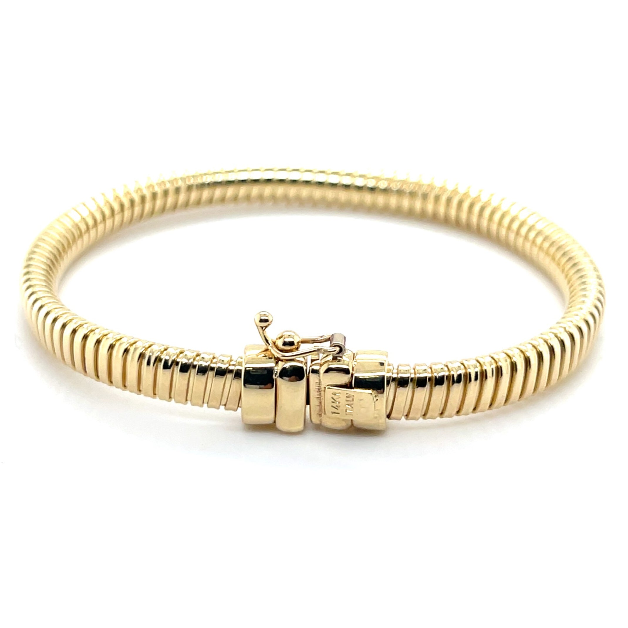 Elegant 14K yellow gold Tubogas bracelet with a polished coil design that is durable, versatile, and timeless. A luxury jewelry piece perfect for everyday wear, birthdays, anniversaries, or milestone celebrations, offering both comfort and sophistication.