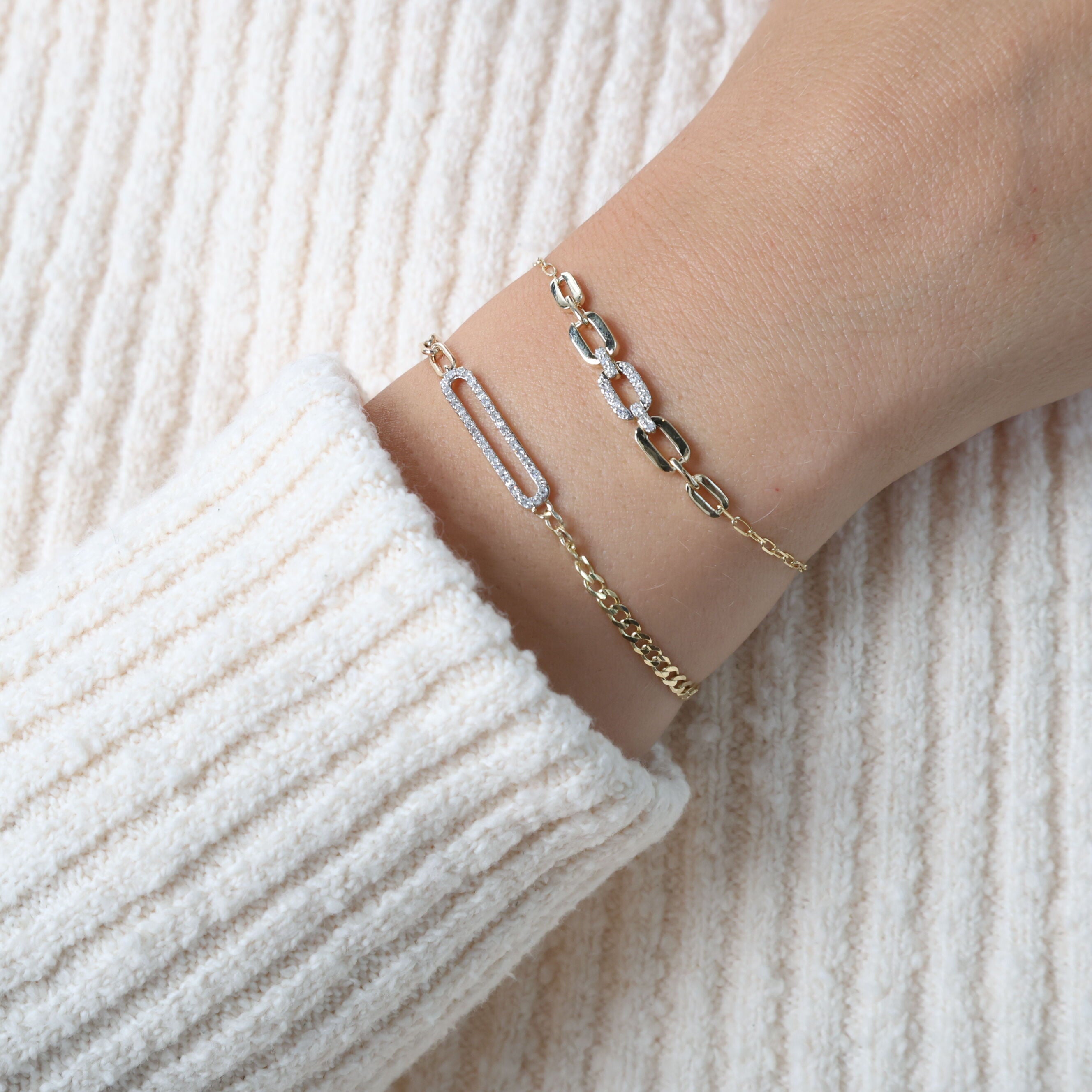 Worn with a white blouse and minimal accessories, this 14K Yellow Gold Graduated Paperclip Bracelet adds a sophisticated sparkle to a simple, elegant look. Perfect for daily wear or a lunch date.