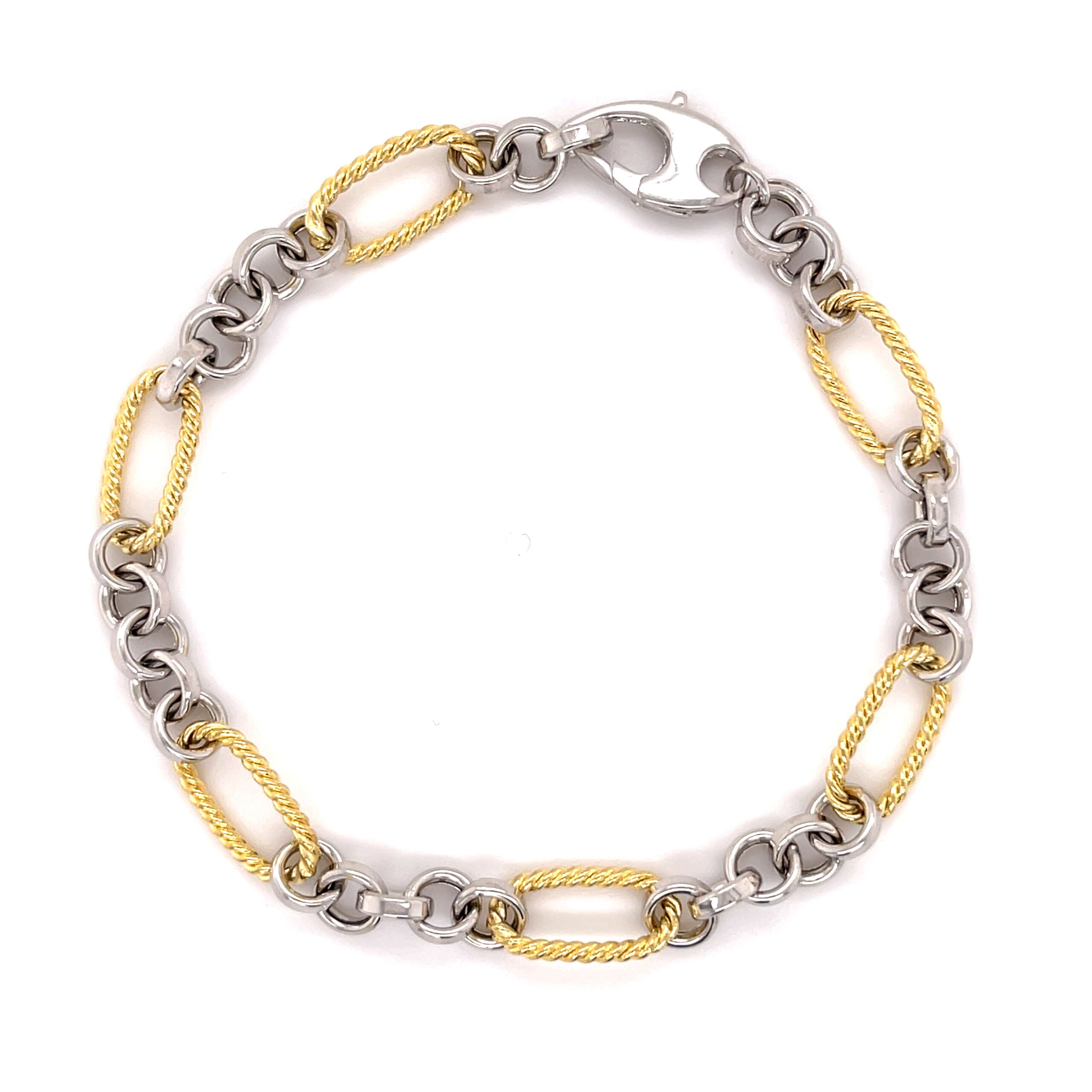 14K solid gold two tone bracelet featuring alternating yellow gold oval links and polished white gold round links for a refined contrast. With a classic lobster claw clasp, this durable and tarnish-resistant bracelet is versatile enough for everyday wear and elegant enough for special occasions. A timeless gift for birthdays, anniversaries, weddings, or milestone celebrations.