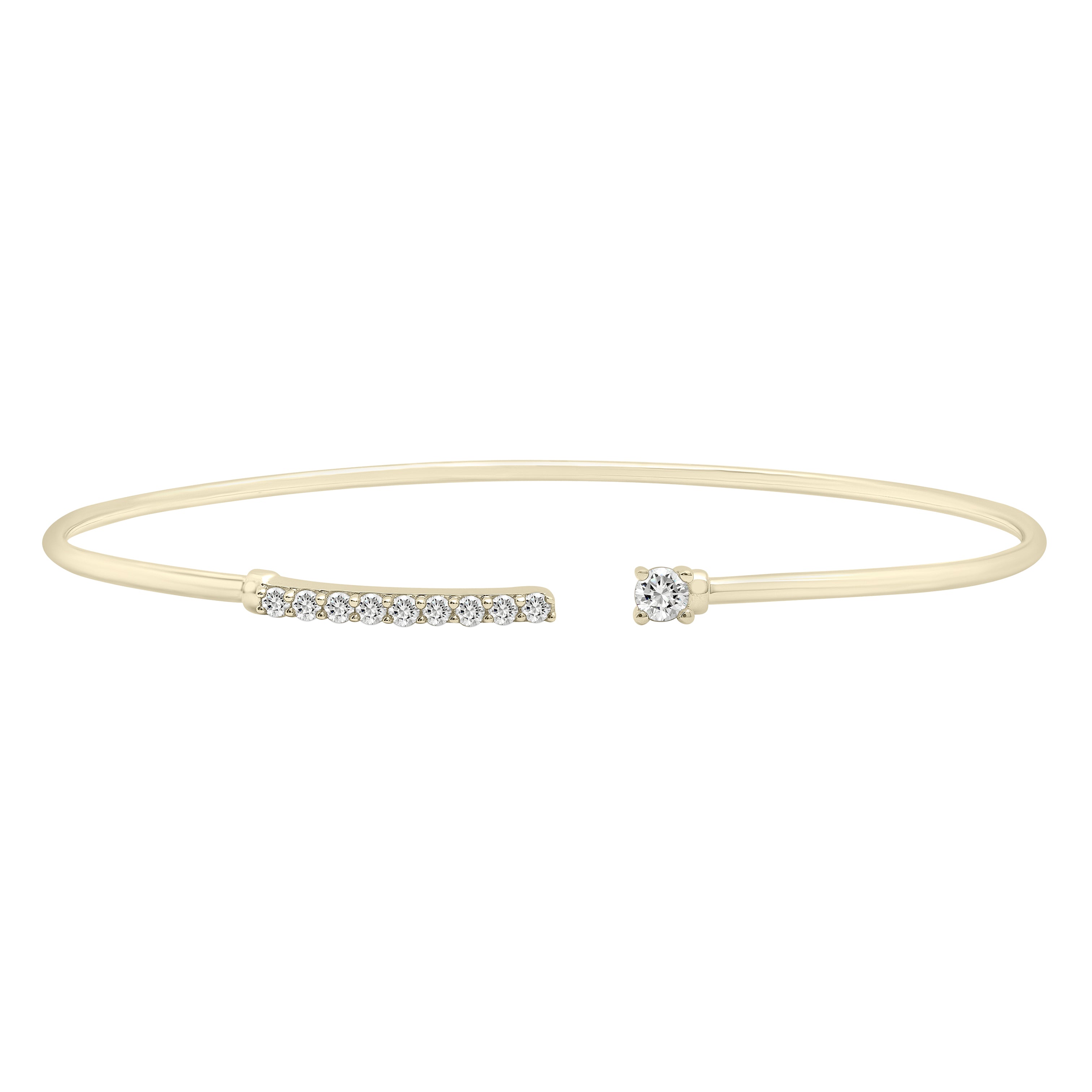 The 14K Yellow Gold Diamond Bar Cuff Bangle Bracelet features a sleek bar design with pave-set natural diamonds, adding a touch of sophistication and sparkle to any outfit. Perfect for both casual and formal occasions.