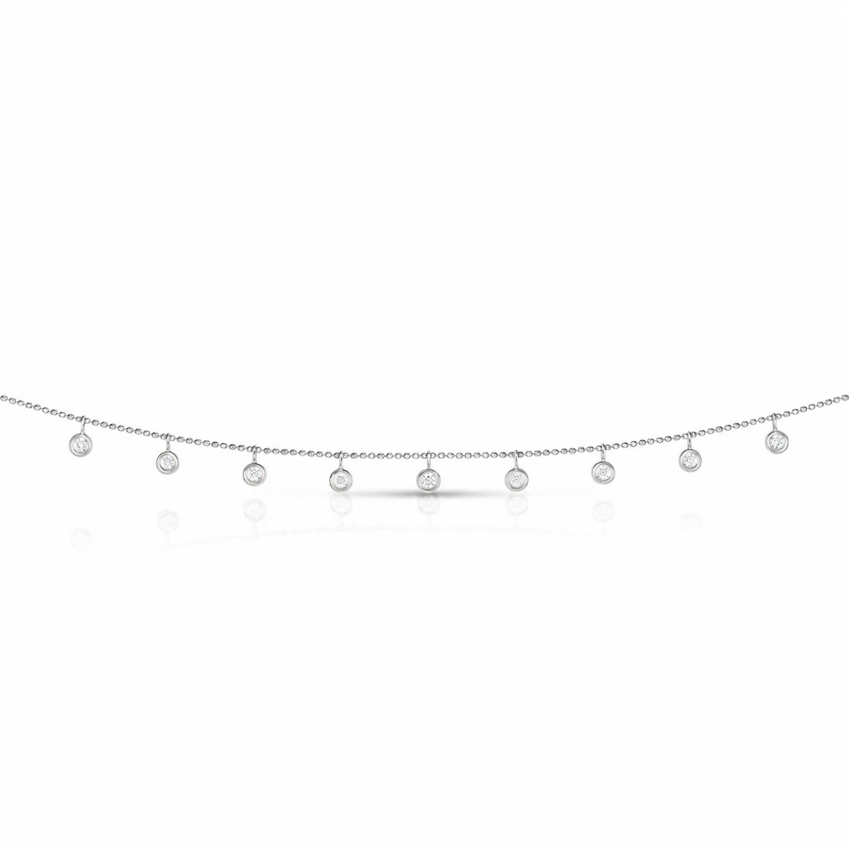 14K white gold necklace with nine dangling round bezel-set diamonds on a fine chain