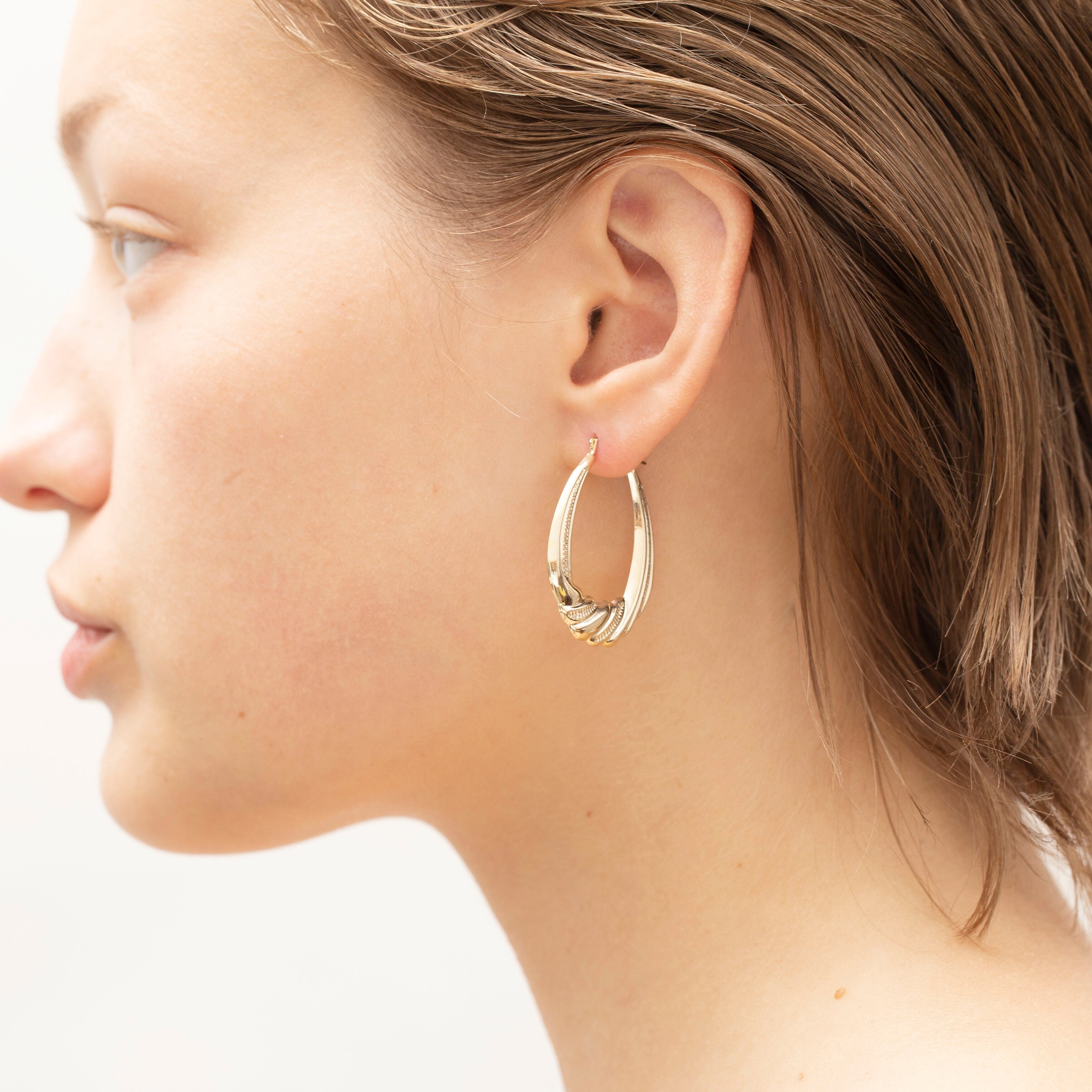 14K Gold Graduated Twist Oval Puffed Hoops