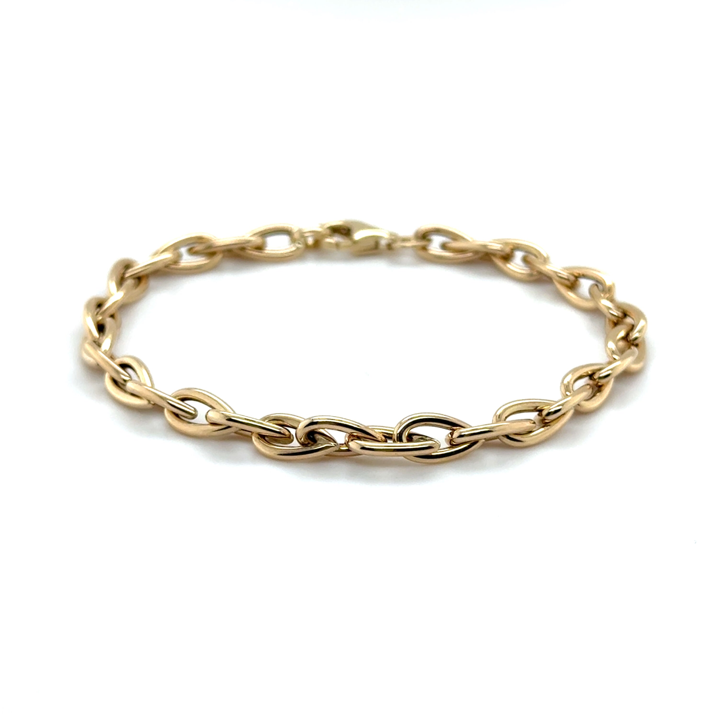 Modern 14K Yellow Gold Pear-Shaped Bracelet offering a fresh and stylish look perfect for layering or standalone wear.