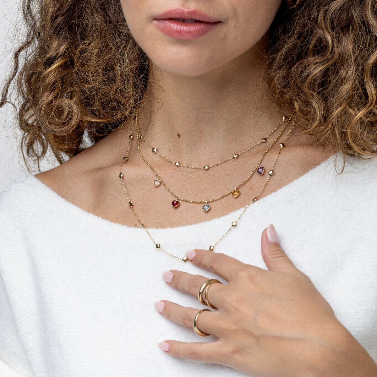 14K yellow gold ball-chain necklace featuring five heart-shaped gems: garnet, amethyst, citrine, blue topaz, white topaz