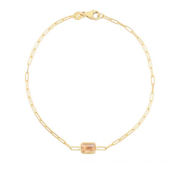 A dainty 14K yellow gold paperclip bracelet featuring a natural baguette-cut Citrine gemstone, the November birthstone symbolizing prosperity and optimism. This elegant and minimalist design is made with real Citrine and crafted for durability, versatility, and everyday comfort. A meaningful jewelry gift for birthdays, anniversaries, and milestone celebrations.