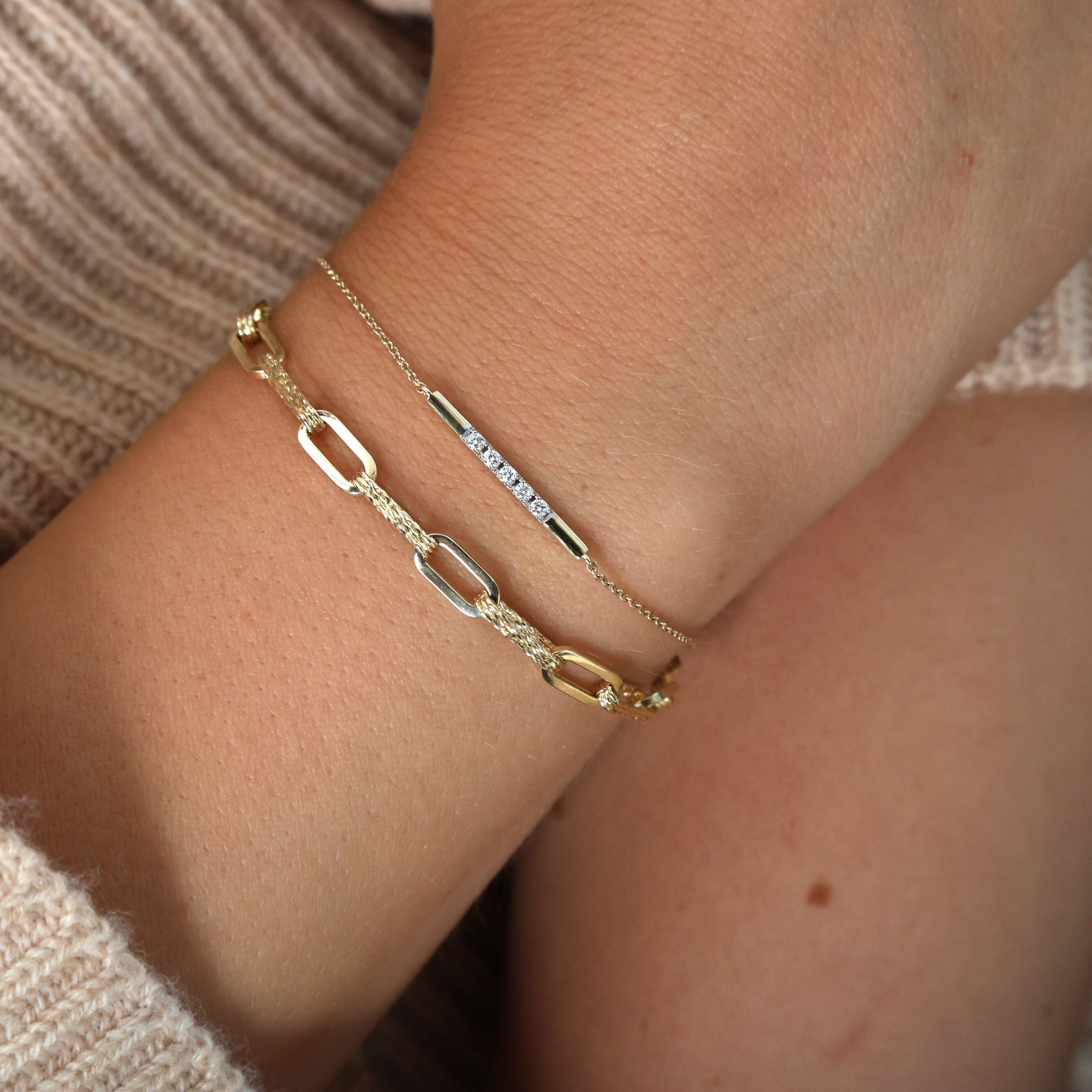 Diamond Bar Chain Bracelet in 14K Yellow Gold worn on the wrist with a neutral beige outfit. Its delicate diamonds bring timeless sophistication, elevating the look with calm elegance. Ideal for anniversaries, dinner dates, or polished day-to-night wear.