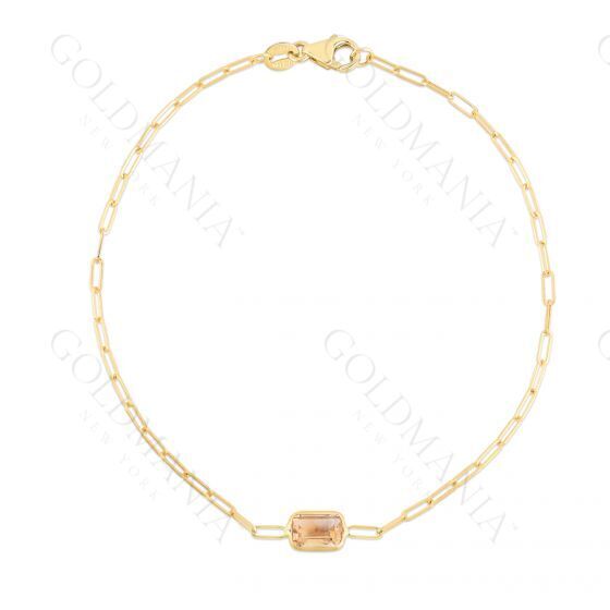 A dainty 14K yellow gold paperclip bracelet featuring a natural baguette-cut Citrine gemstone, the November birthstone symbolizing prosperity and optimism. This elegant and minimalist design is made with real Citrine and crafted for durability, versatility, and everyday comfort. A meaningful jewelry gift for birthdays, anniversaries, and milestone celebrations.