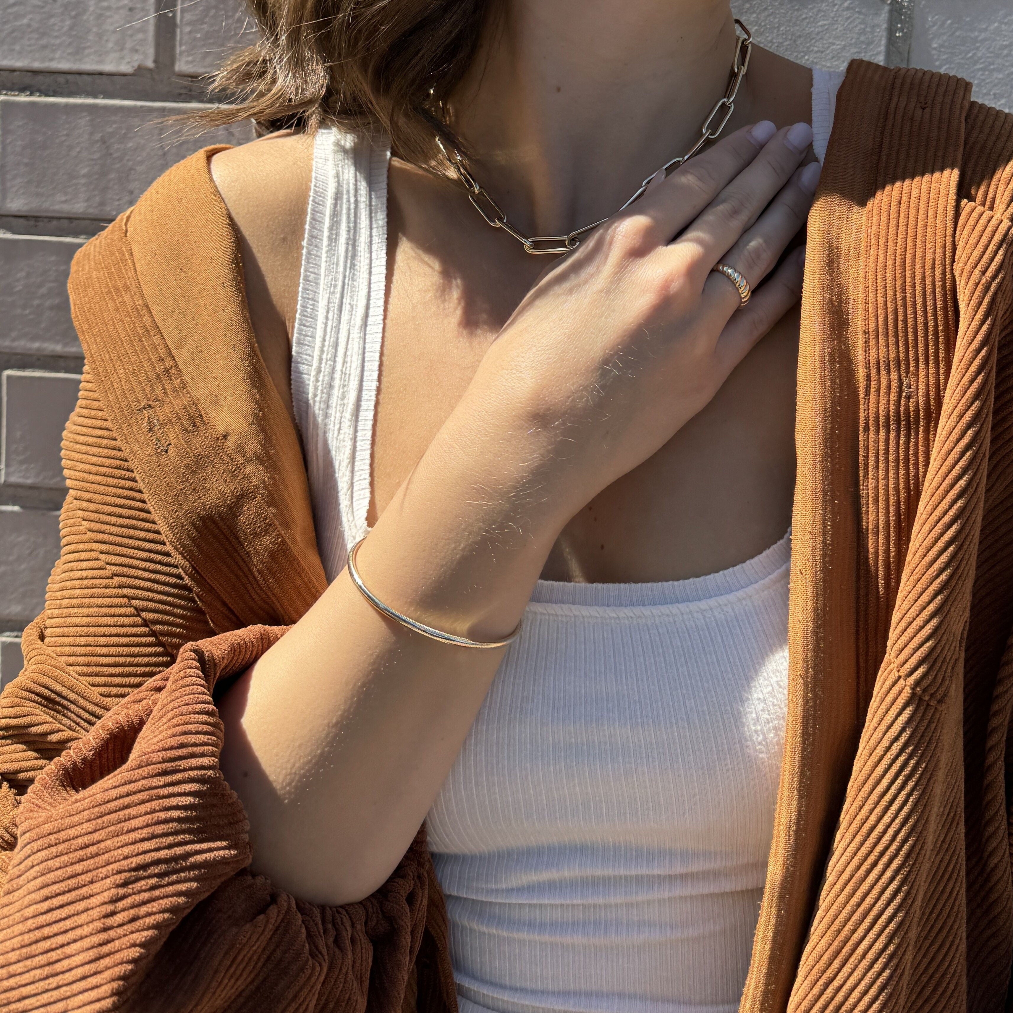 A sleek 14K Gold Bangle, great for layering and gifting on anniversaries or casual events.