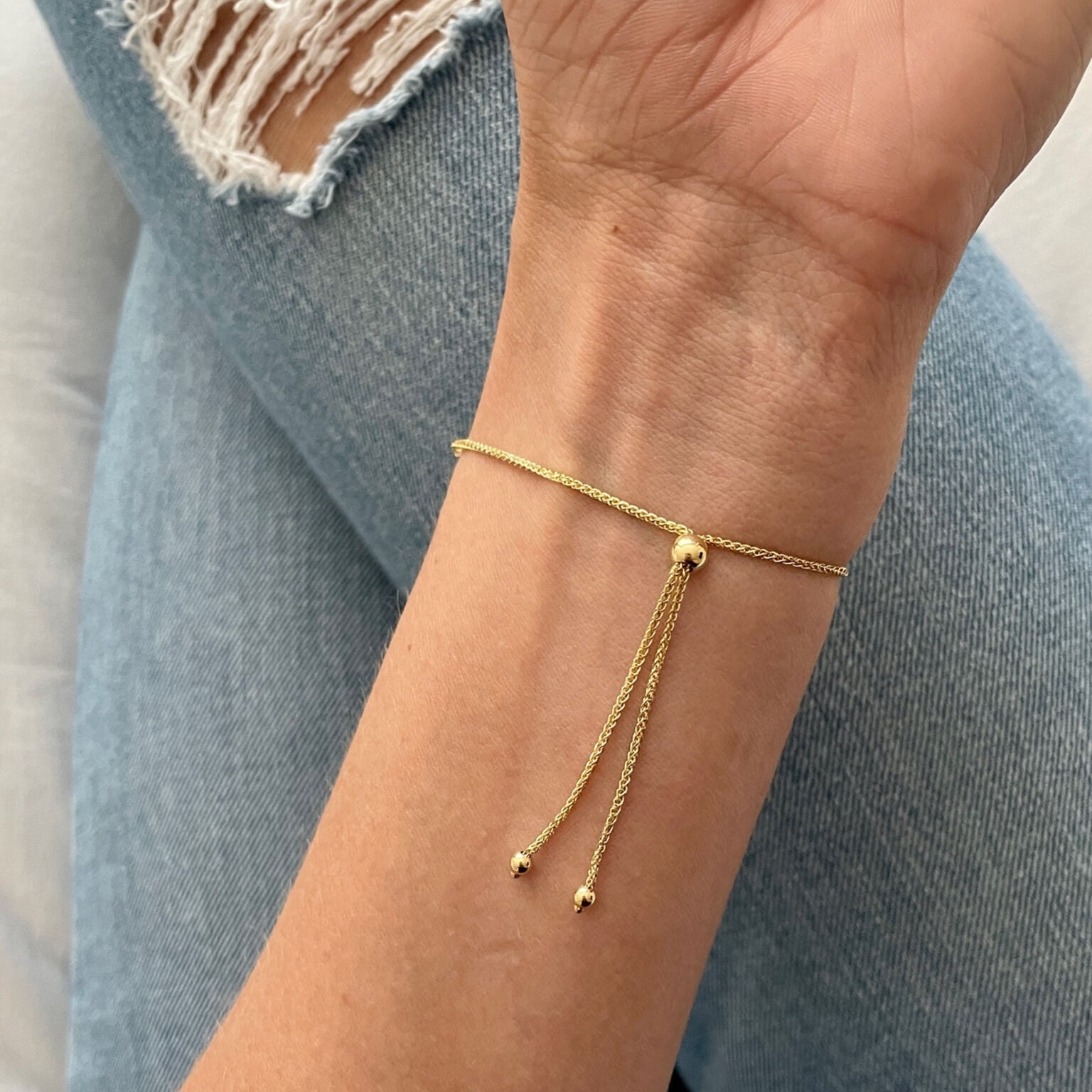 Polished Gold Bar Bracelet worn with beige knit and soft natural lighting, perfect for effortless elegance in cozy fall or everyday home styling
