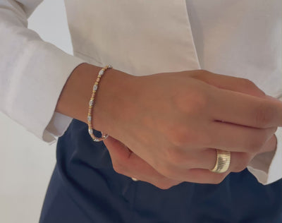 14K Tricolor Gold Barrel Bead Bracelet worn with casual outfit, adding a touch of sophistication and shine for everyday style.