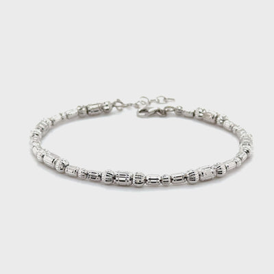 Elegant 14K White Gold Barrel Bracelet with diamond cut beads provides a tarnish resistant design and a secure lobster clasp for everyday comfort.