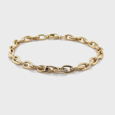 Elegant 14K Yellow Gold Pear-Shaped Bracelet with tarnish-resistant solid gold links and a secure lobster clasp.